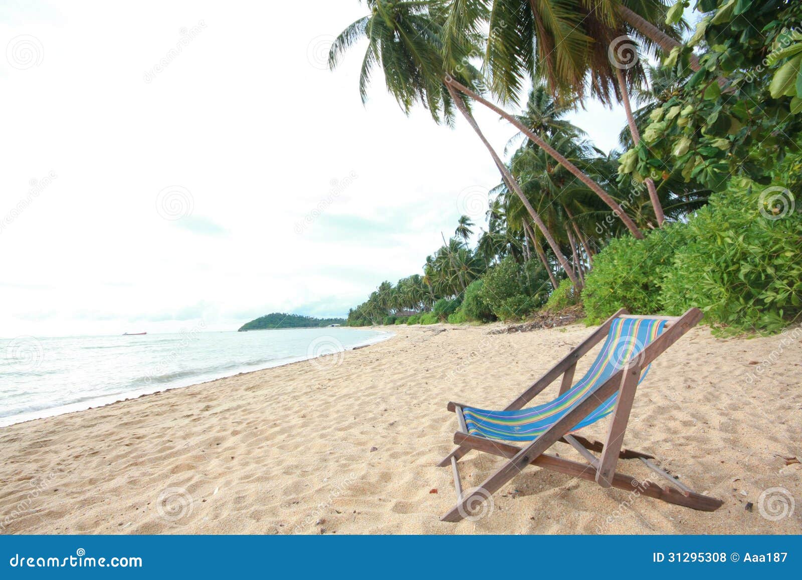 Camp bed on the beach stock photo. Image of parasol, scenery 31295308