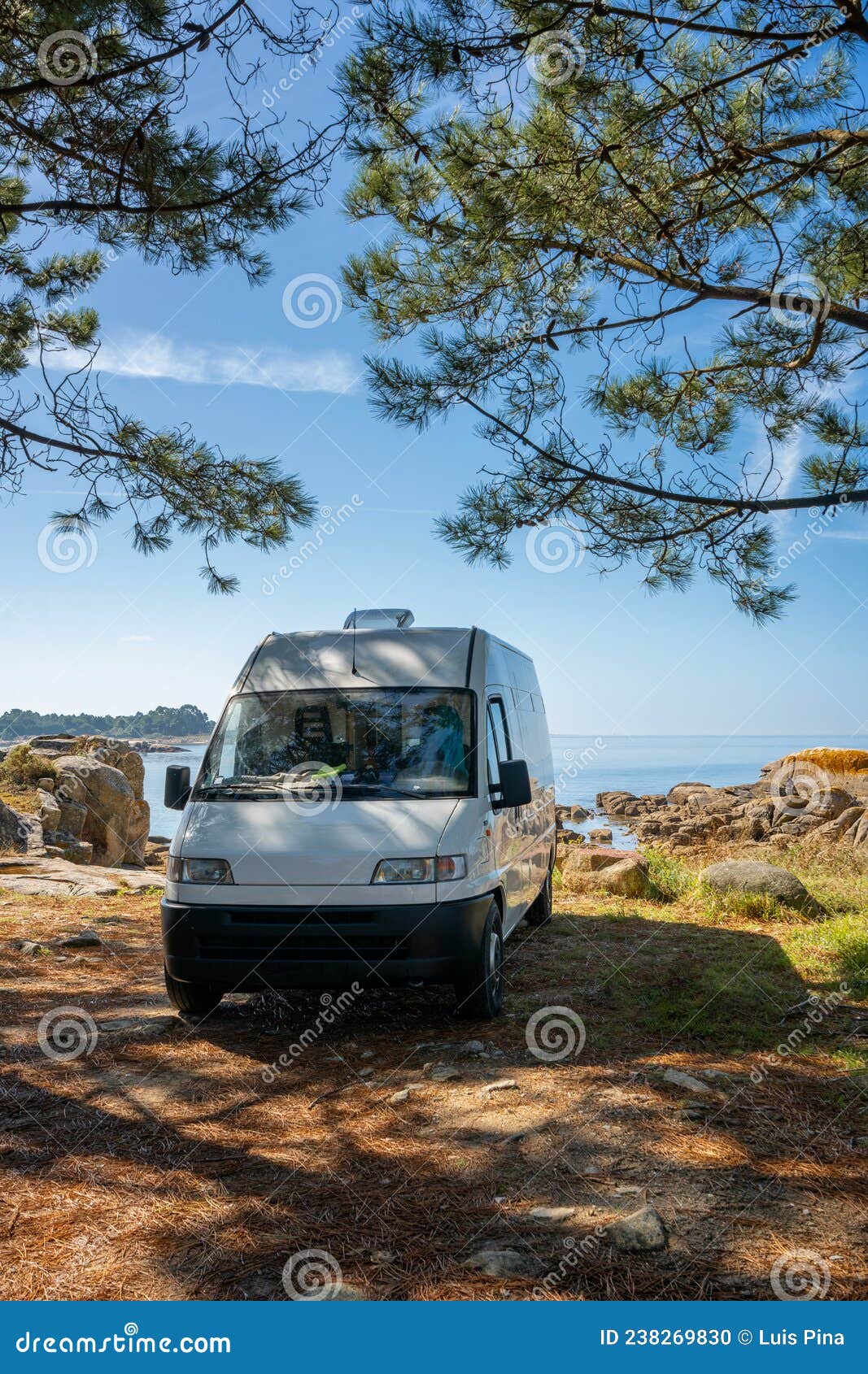camper van on a wild beach in arousa island living van life in galicia, spain