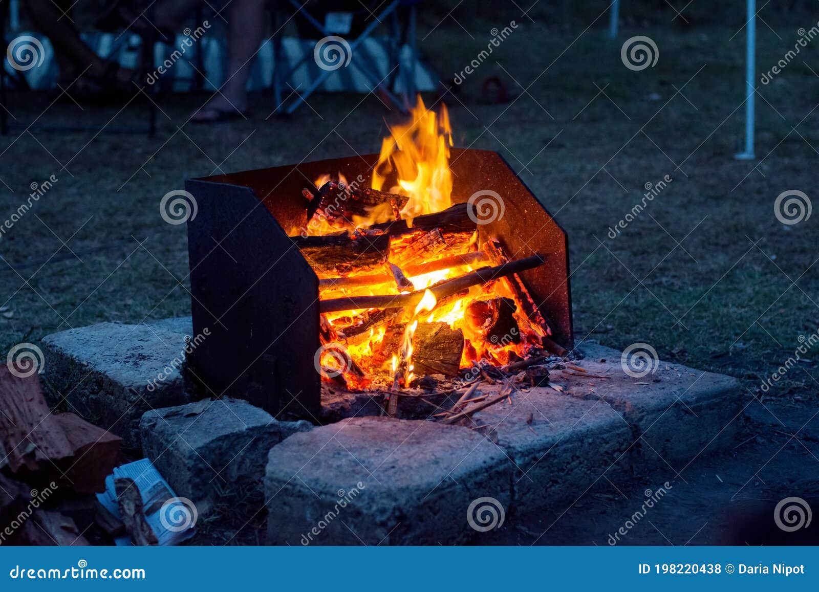 Campfire in a Woodfired Barbeque Fire Pit at the Campsite Stock Photo