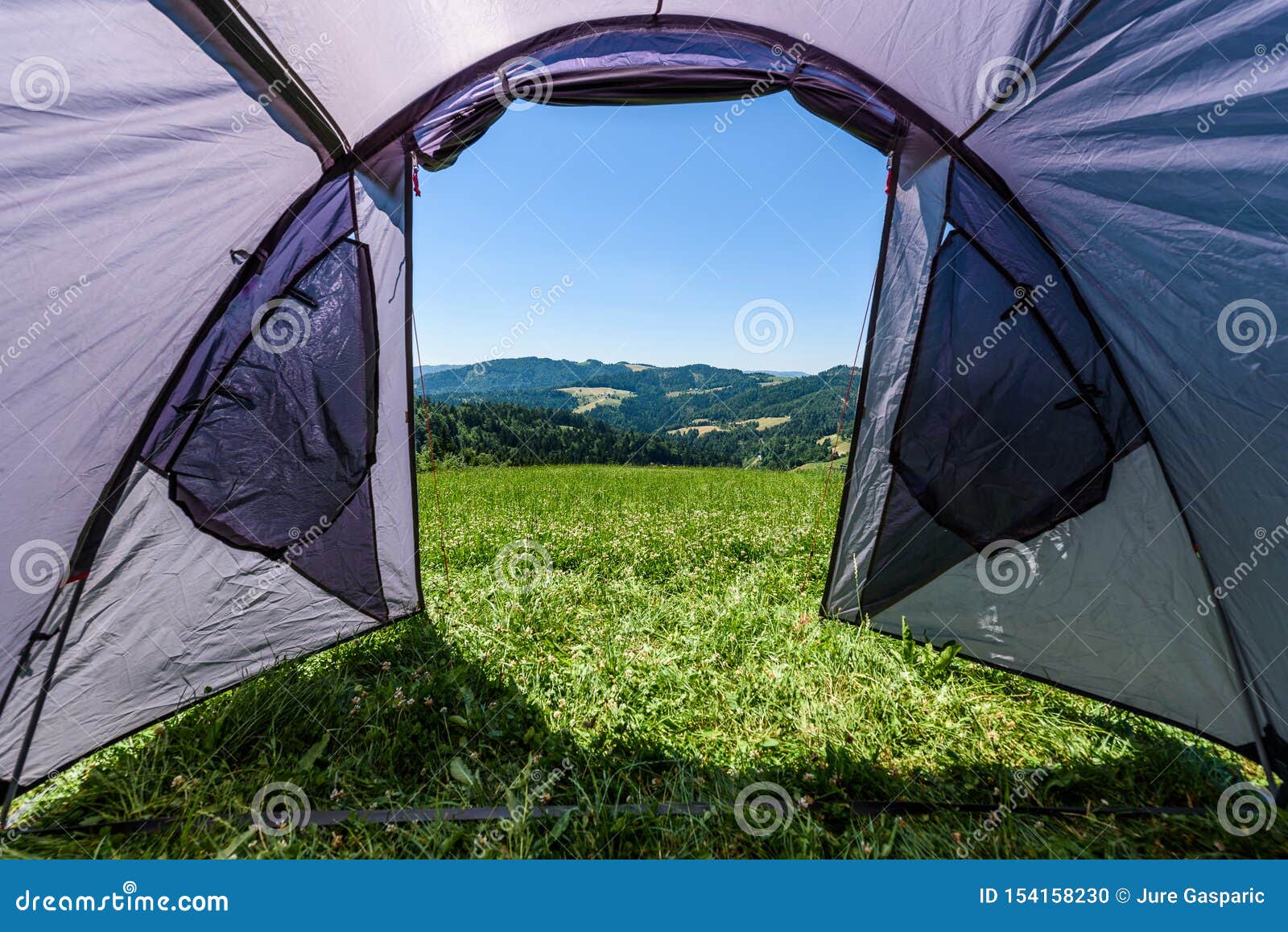 Camping Tourist Tent Set Up on Meadow in the Mountains. Small Tent in ...