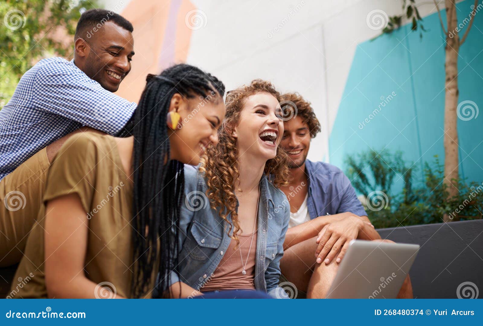 Campus Buddies. a Group of College Students Sitting with a Laptop and