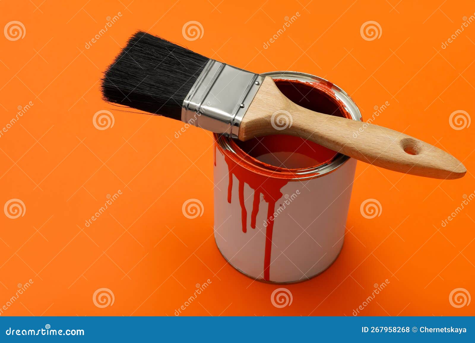 Can of Orange Paint and Brush on Color Background Stock Photo Image