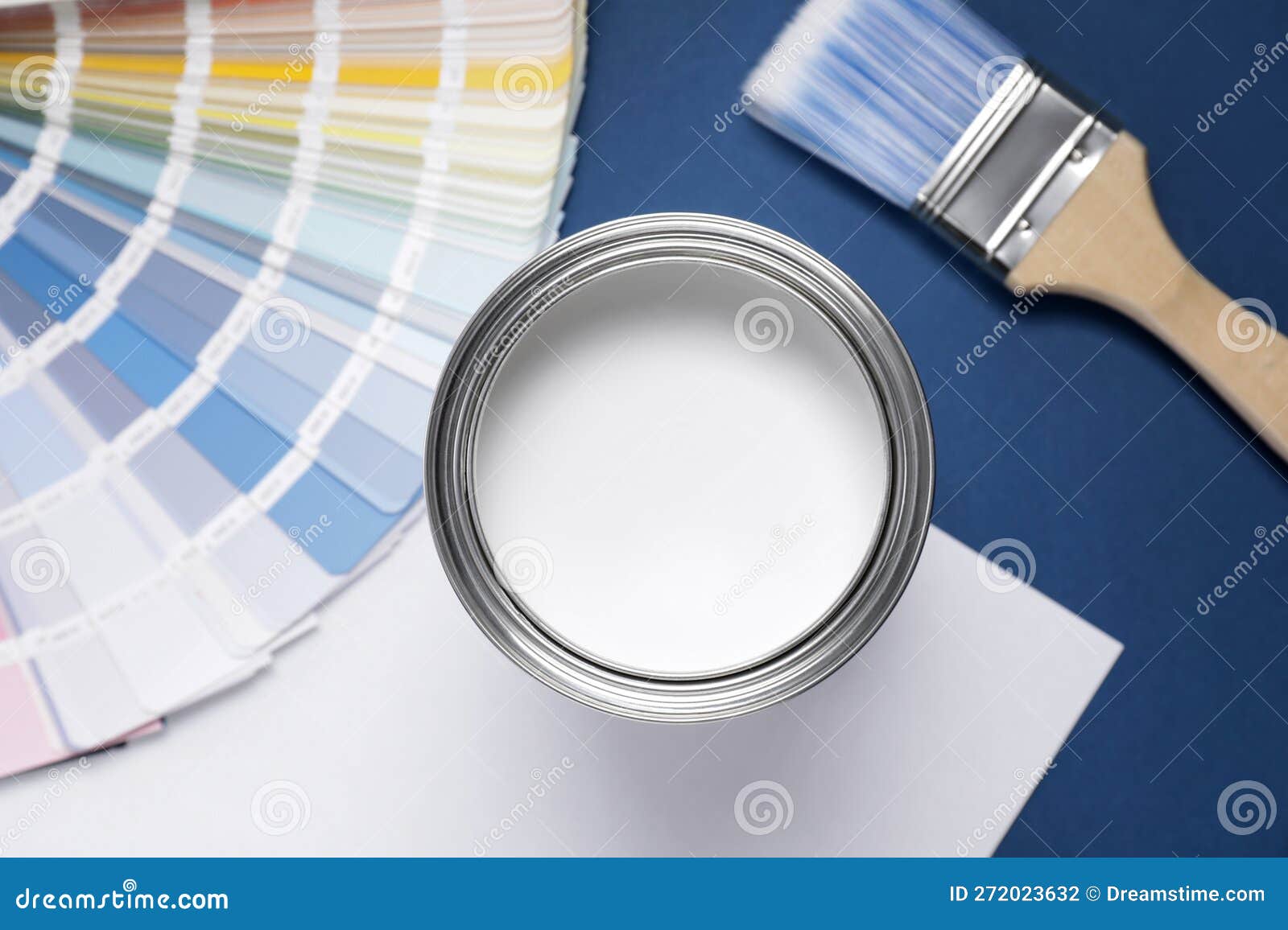 Can with White Paint, Brush and Color Palette on Blue Background, Flat Lay Stock Photo Image