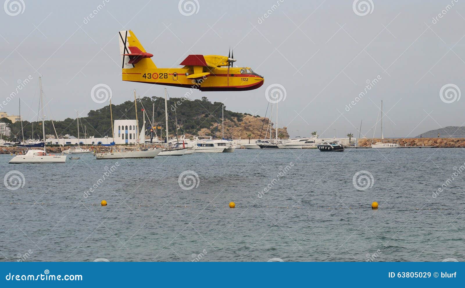 Canadair before taking water 013. A canadair firefighter is close to land on the sea to load water to its reservory in a beach in the north of the Spanish island of Majorca.