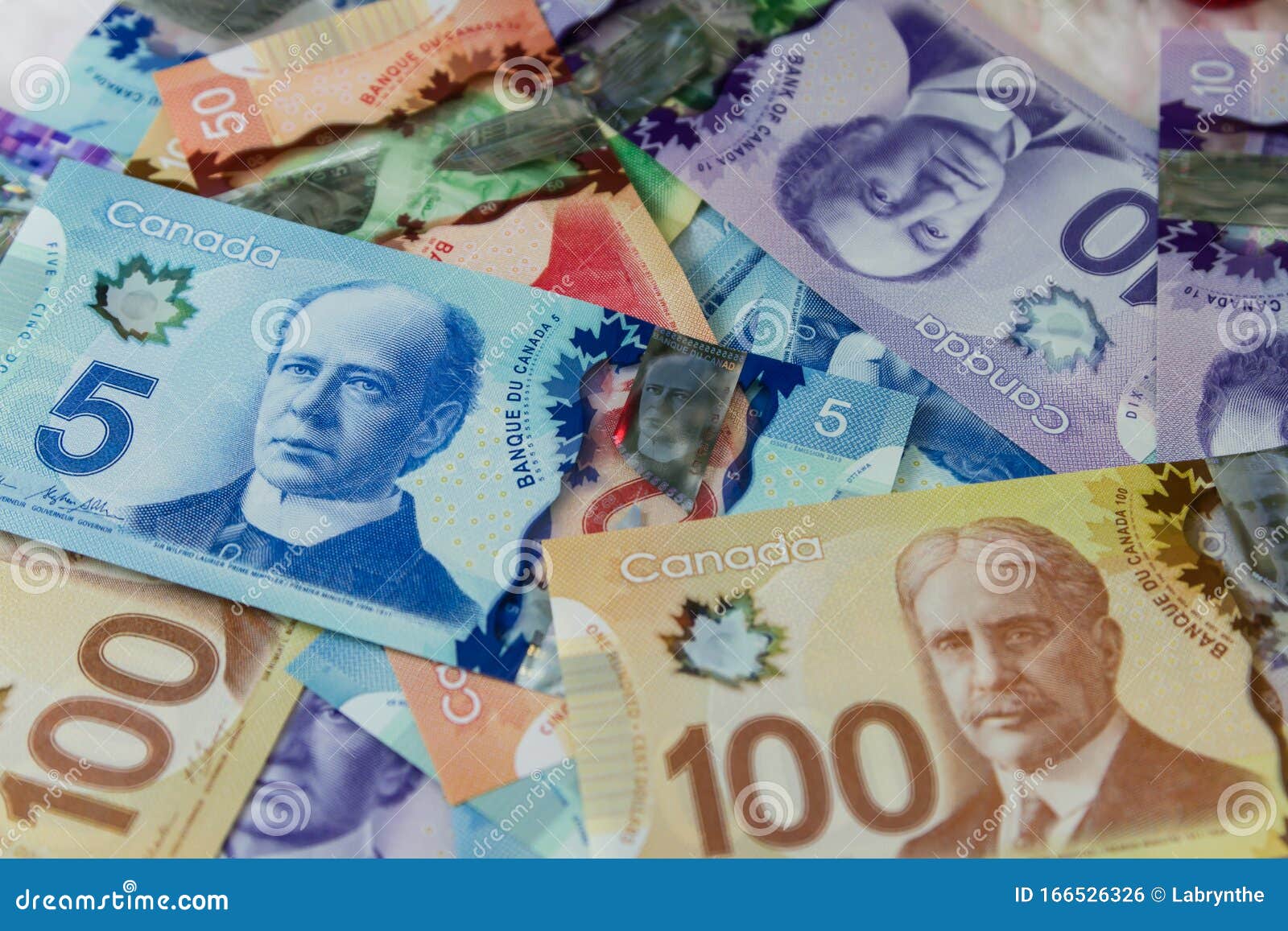 Canadian Dollar Bills On A Table Canadian Currency Stock Photo Image canadian-dollar-bills-on-a-table-canadian-currency-stock-photo-image