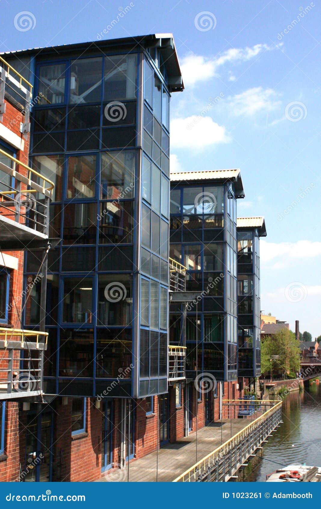 Leeds Canal Wharf At Night With Brightly Illuminated Buildings And Lock