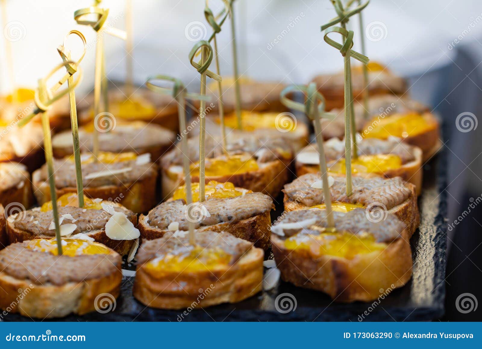 Canapes with White Bread, Pate and Honey. Selective Focus. Stock Photo