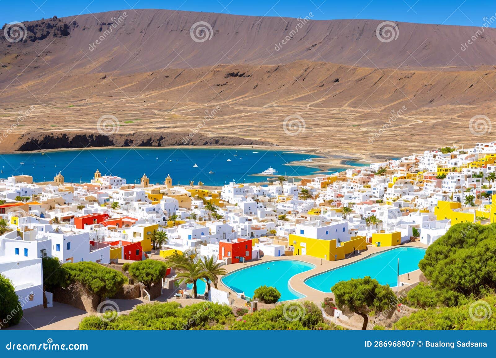 canary islands (spain), la graciosa . caleta del sebo village and la aguja grande volcano, view from the sea