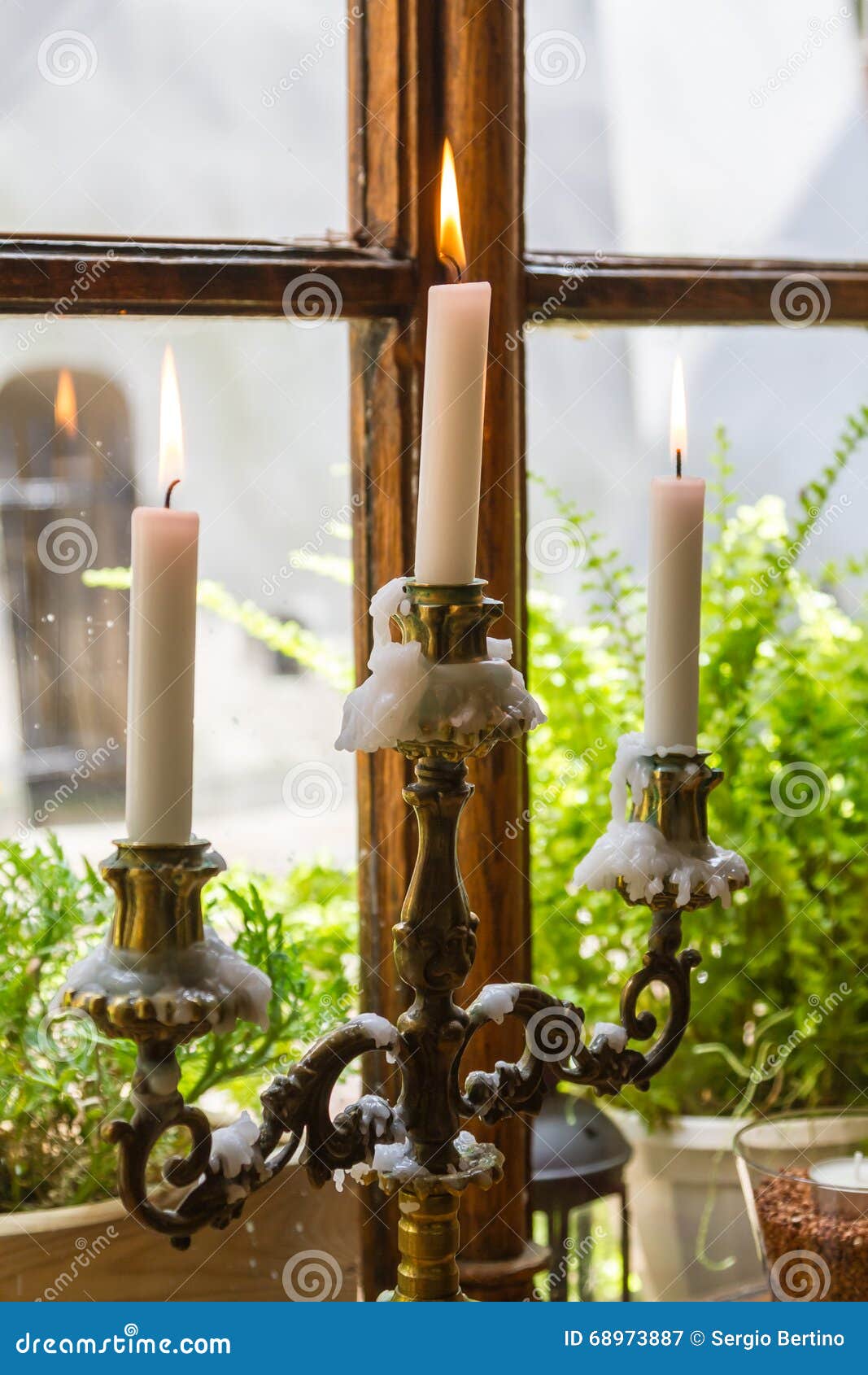Candelabra in a restaurant stock image. Image of flames 68973887