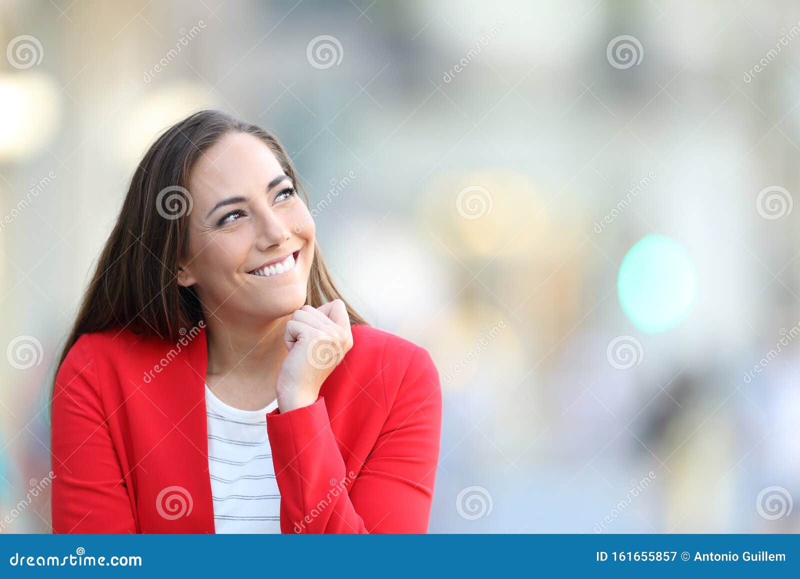 candid woman thinking looking at side in the street