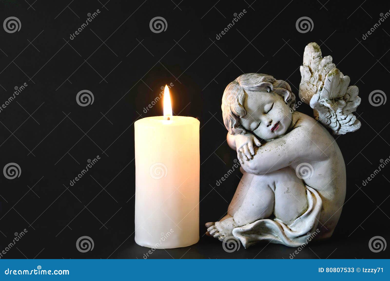 Candle and angel figurine stock image. Image of black 80807533