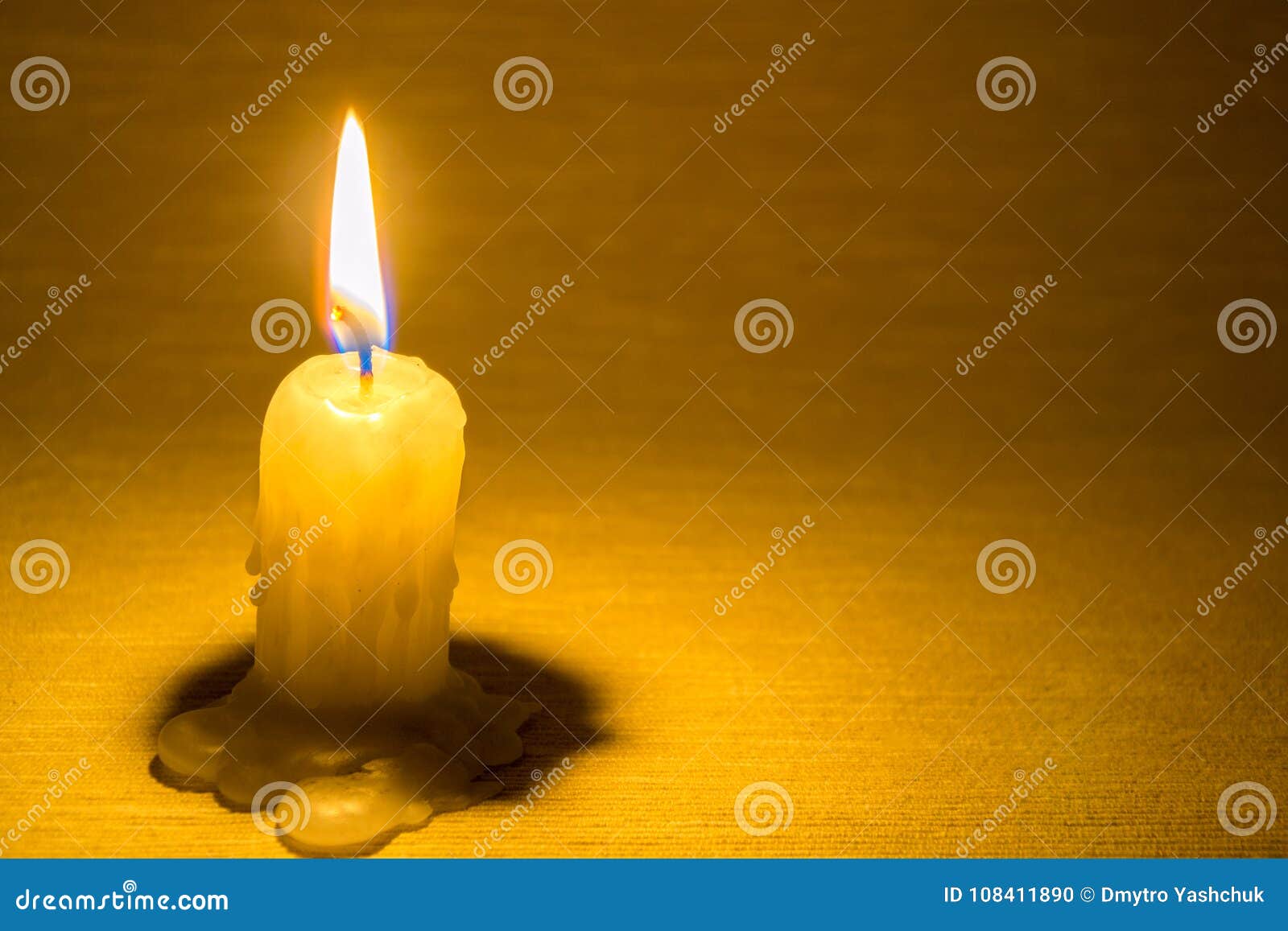 Candle Burn and Warm Light on the Dark Wall Background Stock Photo