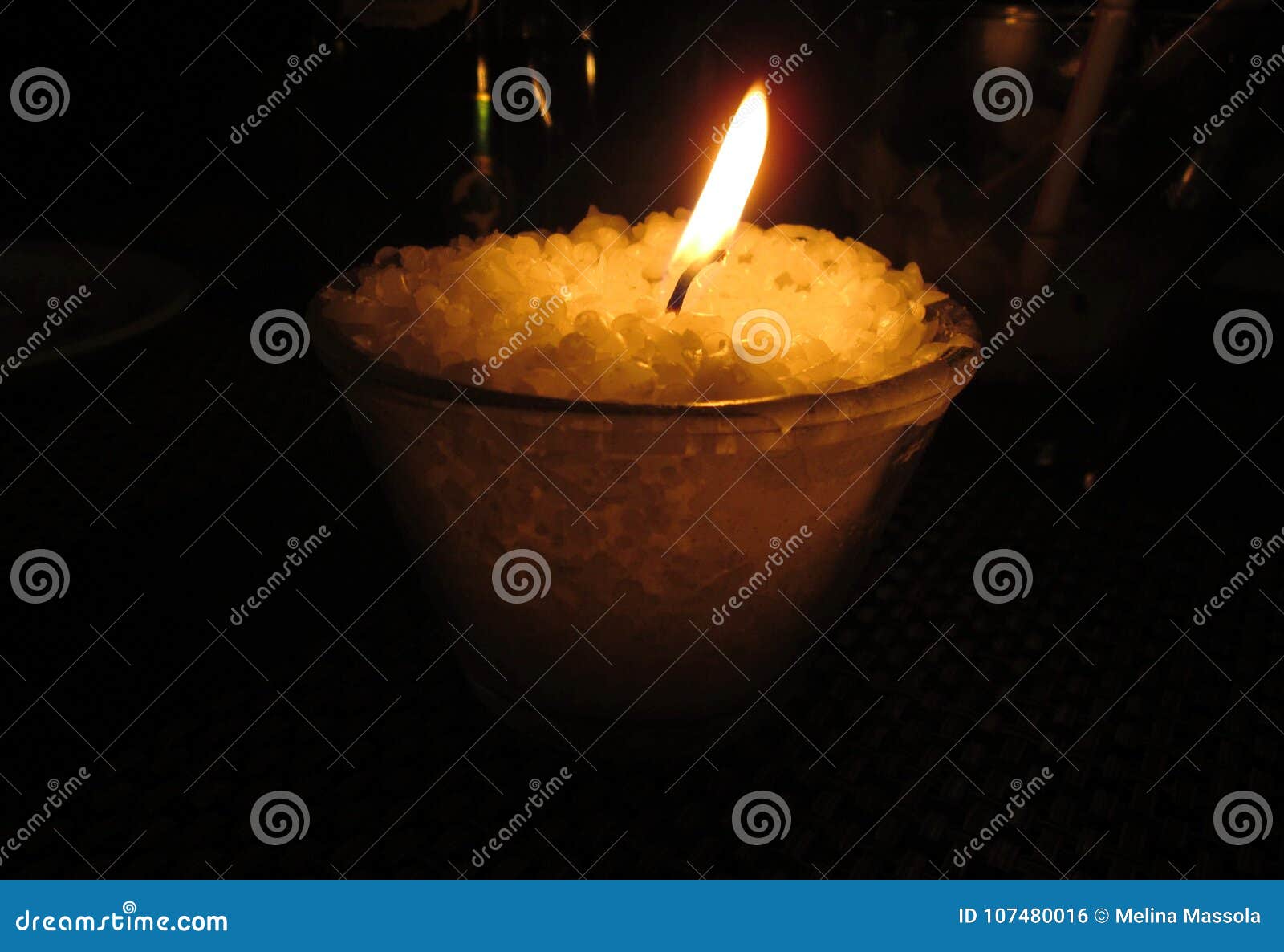 Candle burning in a dinner stock photo. Image of beach 107480016
