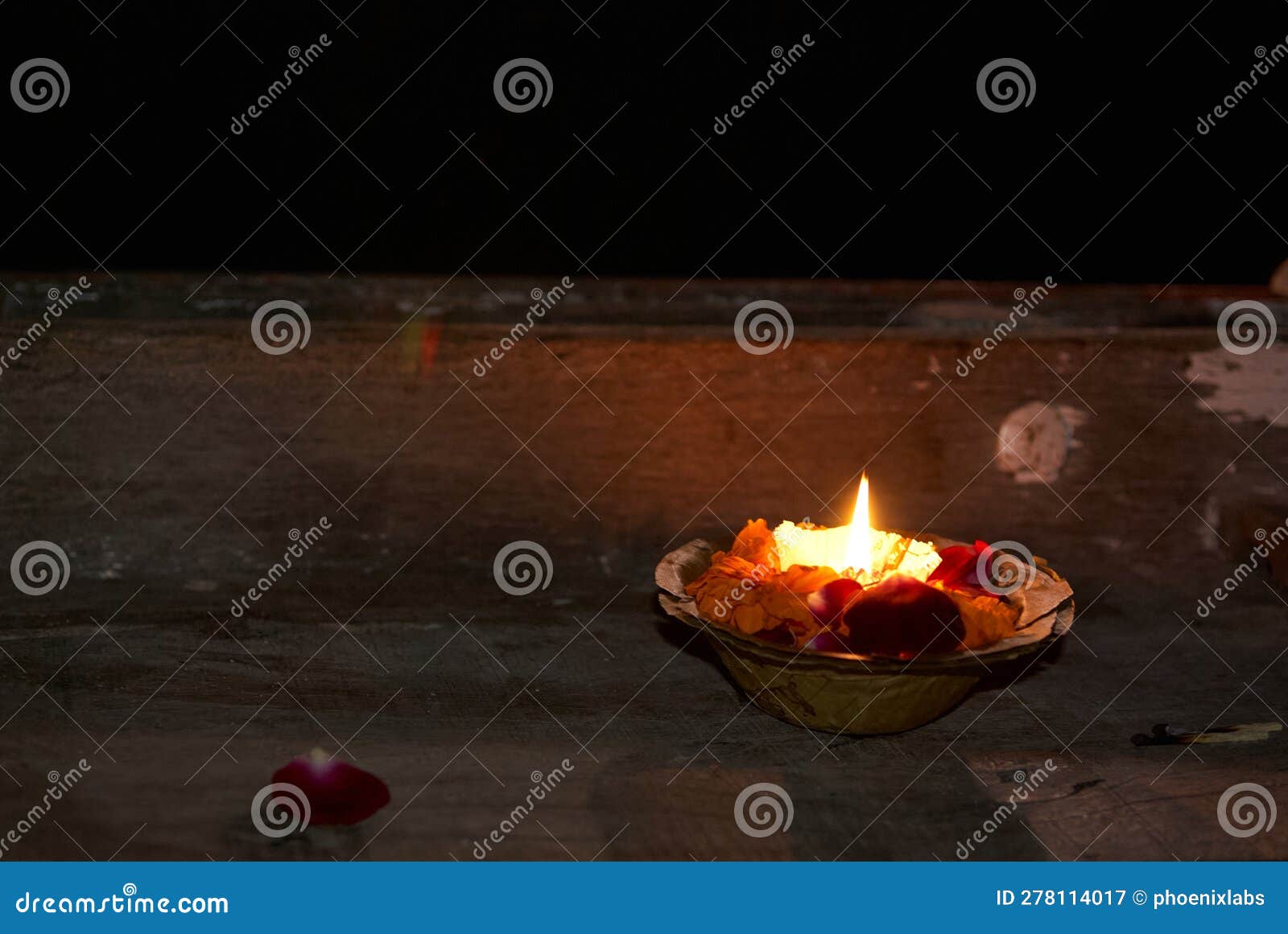 candle burning in the ganges, benares, india
