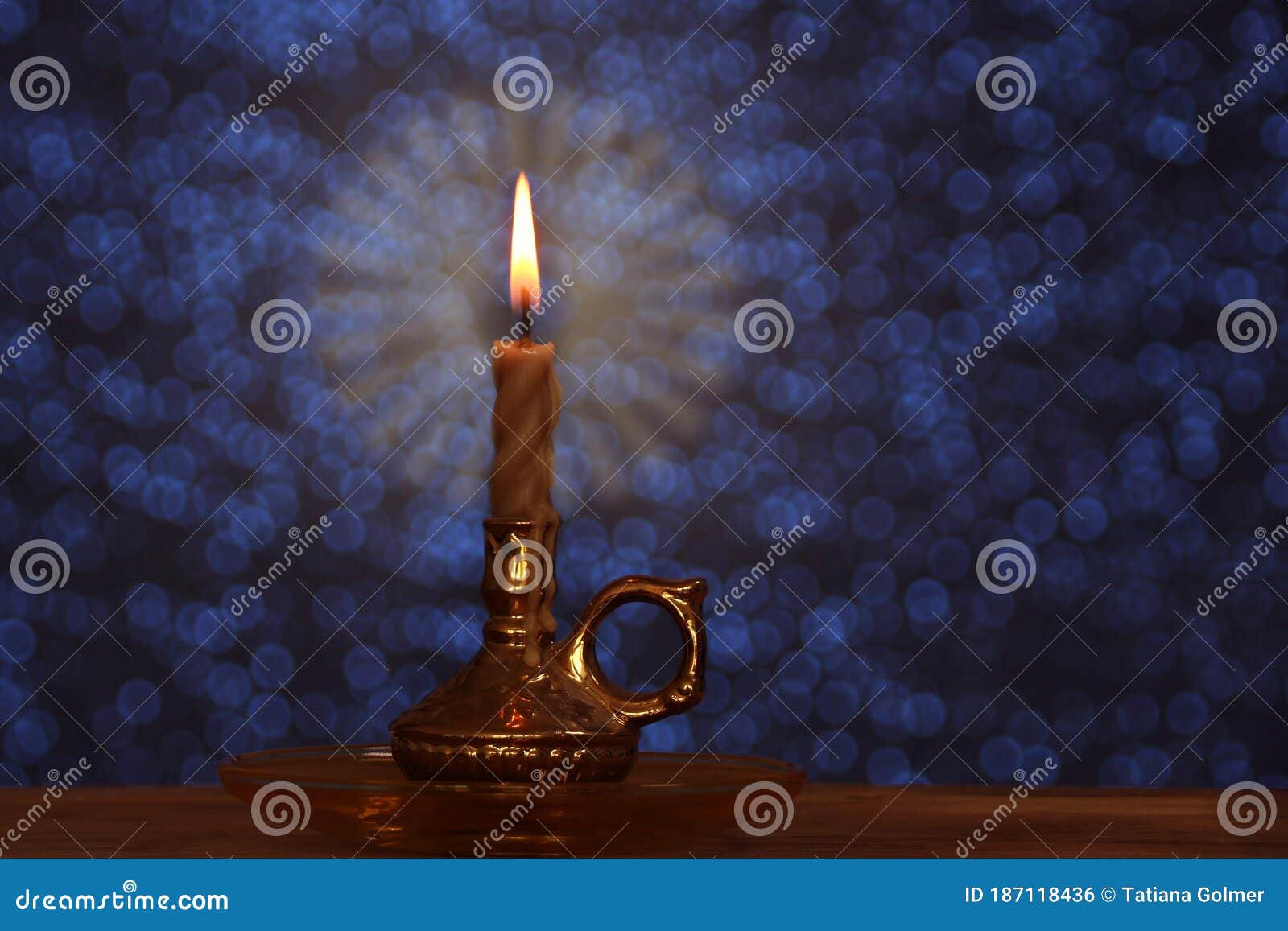 A Candle That Burns Twice As Bright Candle Burns with a Bright Flame in a Candlestick in a Dark Room, the