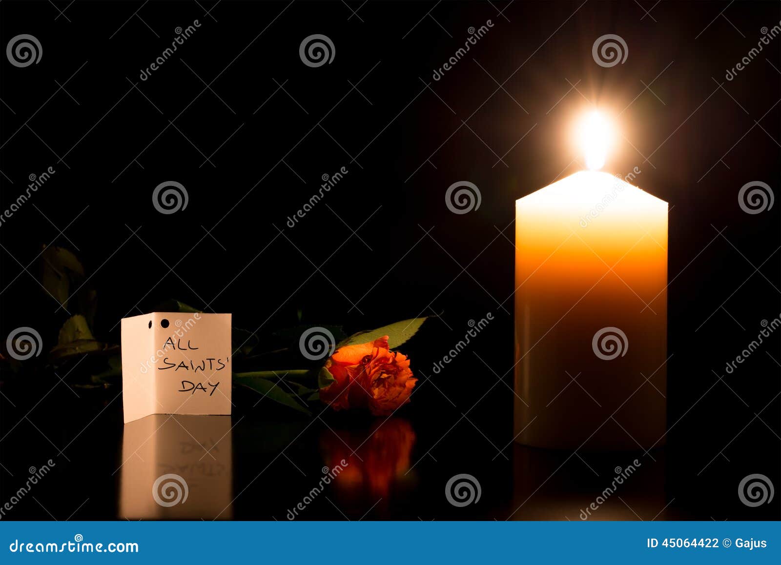 candle in the darkness during all saints day