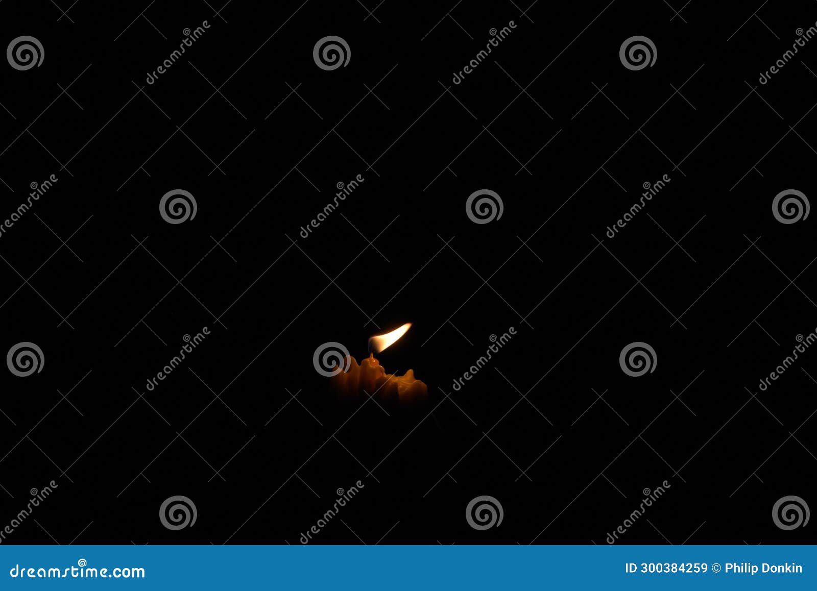 Candle Flame with Exploding Flammable Liquid Sprayed Onto Flame