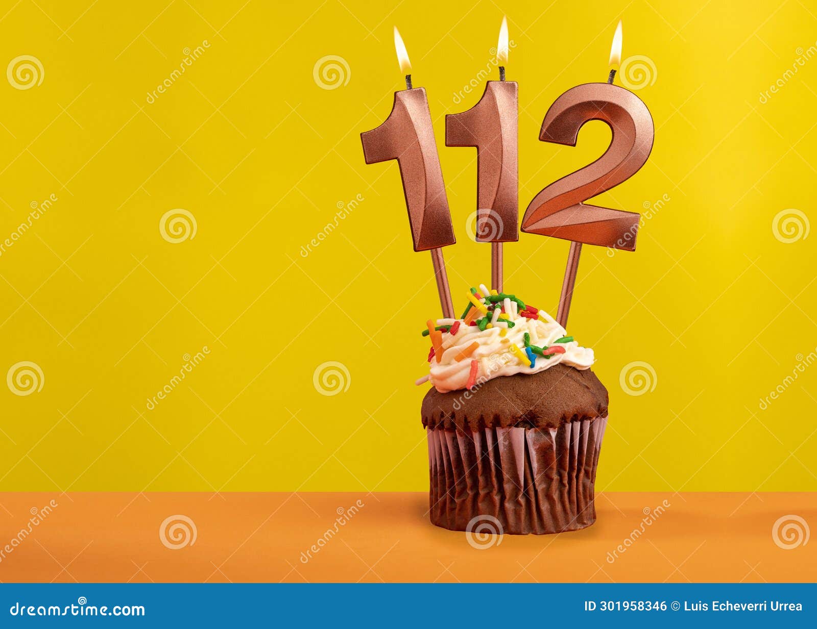 Candle with Flame Number 112 - Birthday Card on Yellow Background Stock