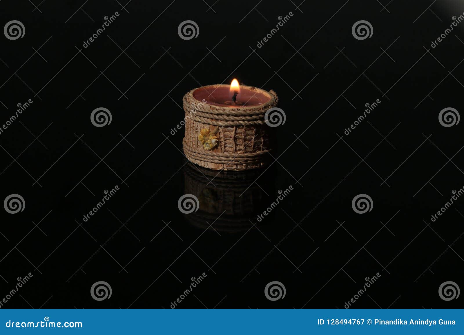 Candle on black glass stock image. Image of darkness 128494767