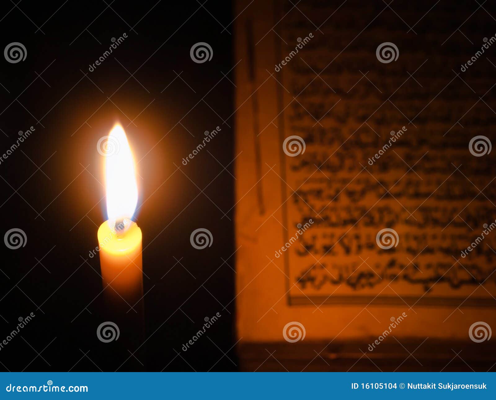Candle light and AlQuran stock photo. Image of bright 16105104