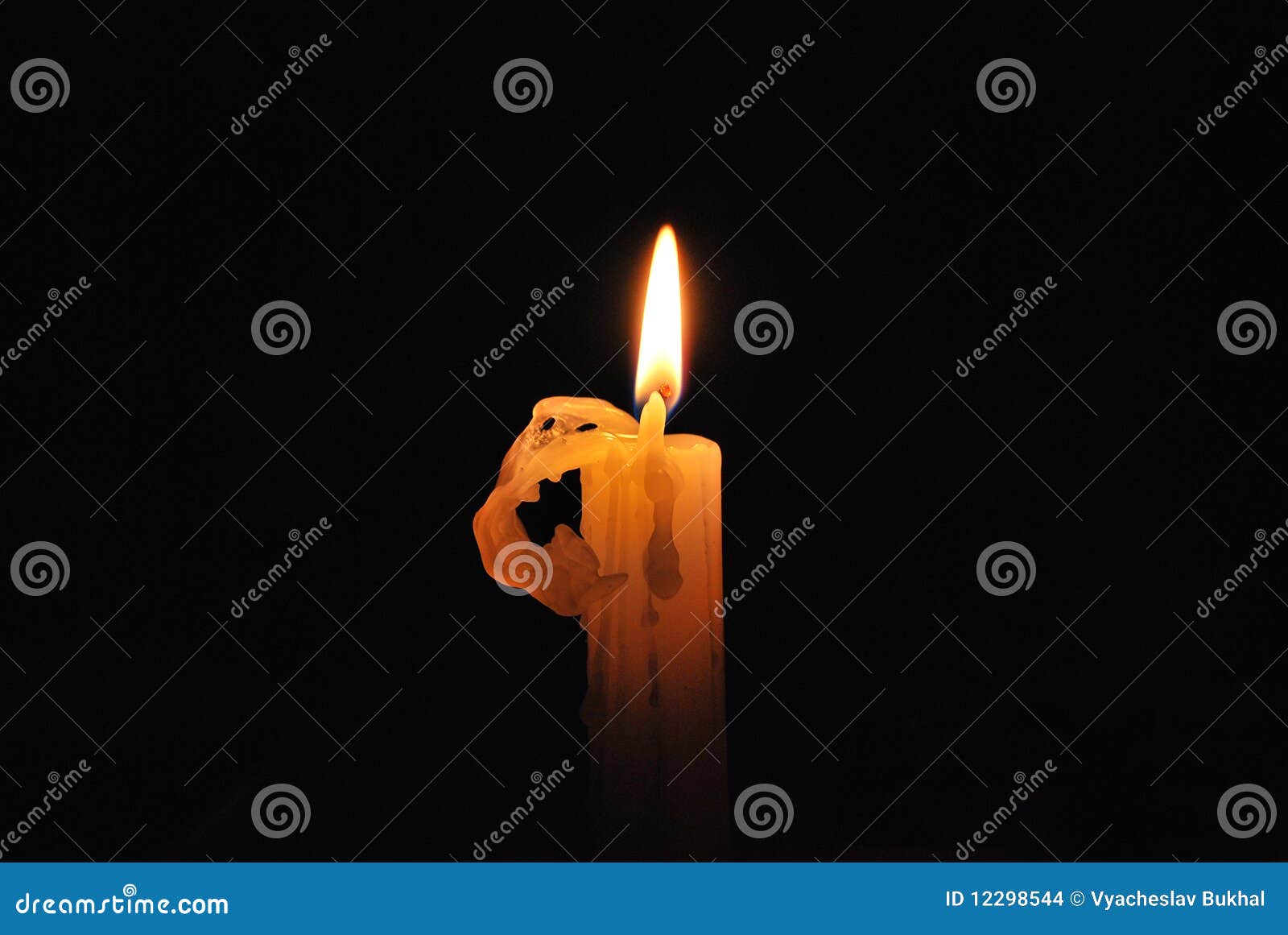 candle lit in the darkness