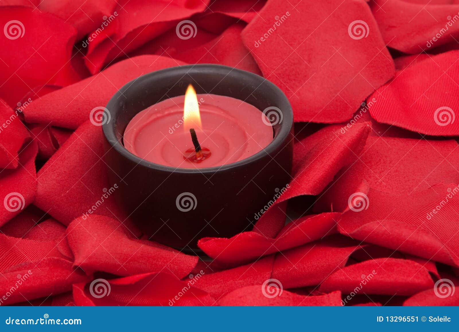 Candle and rose petals stock image. Image of meditation 13296551
