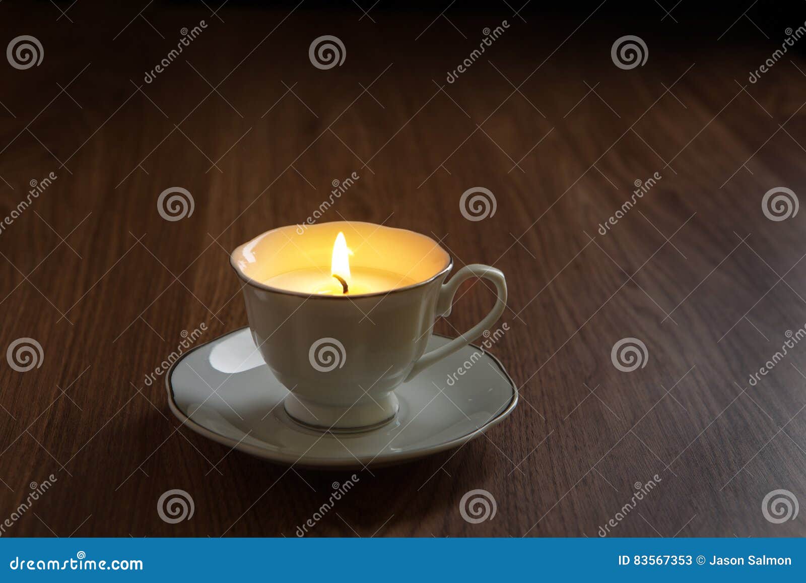 candle in a tea cups