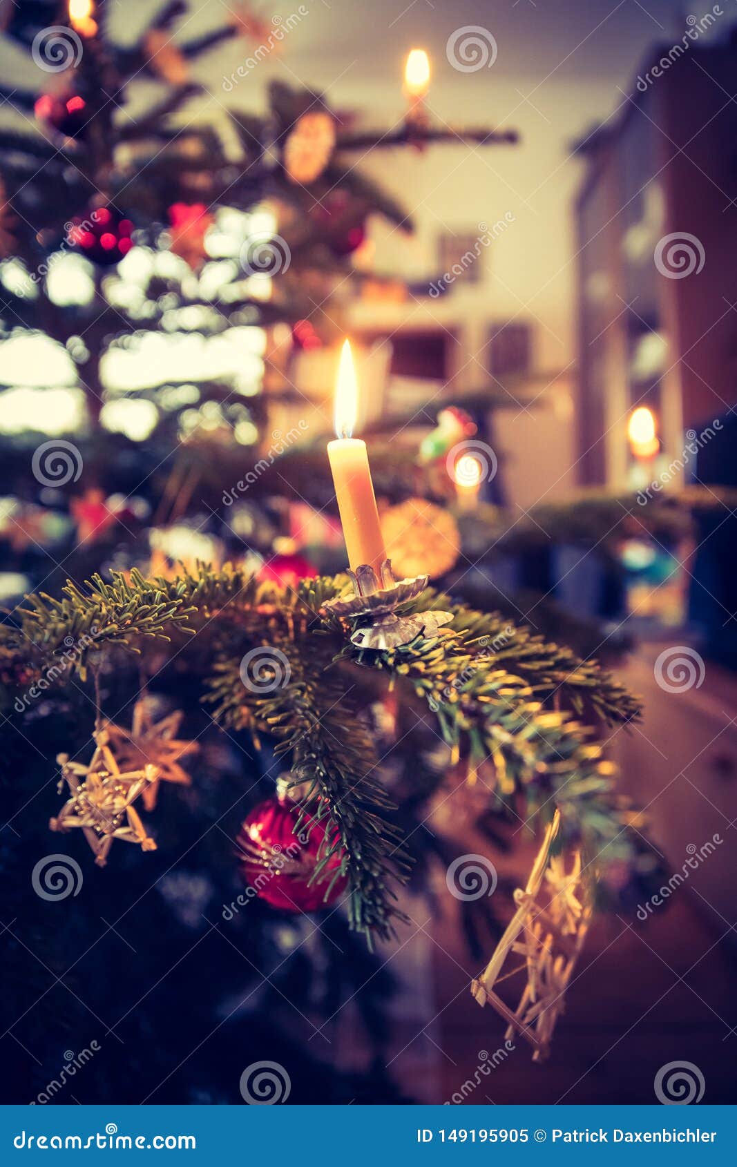Candle on Traditional Decorated Christmas Tree, Evening Stock Image