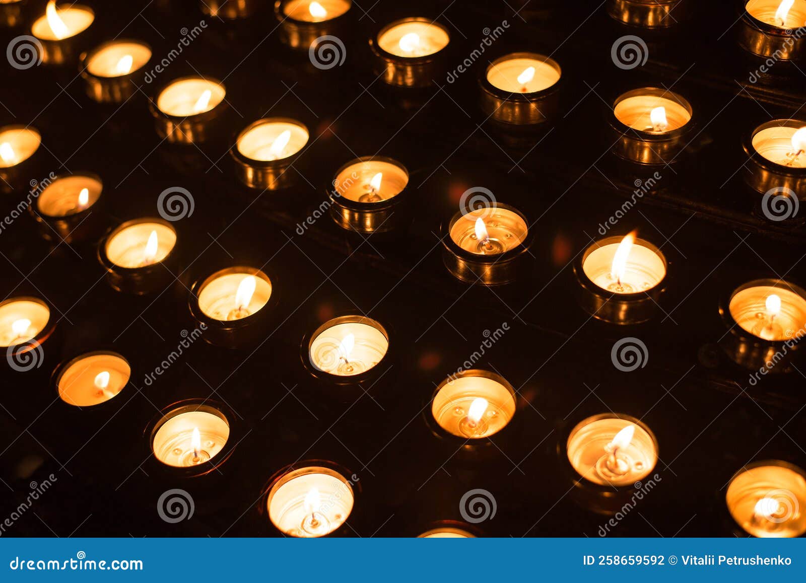 Candles in a church stock photo. Image of pensive, candlelight 258659592