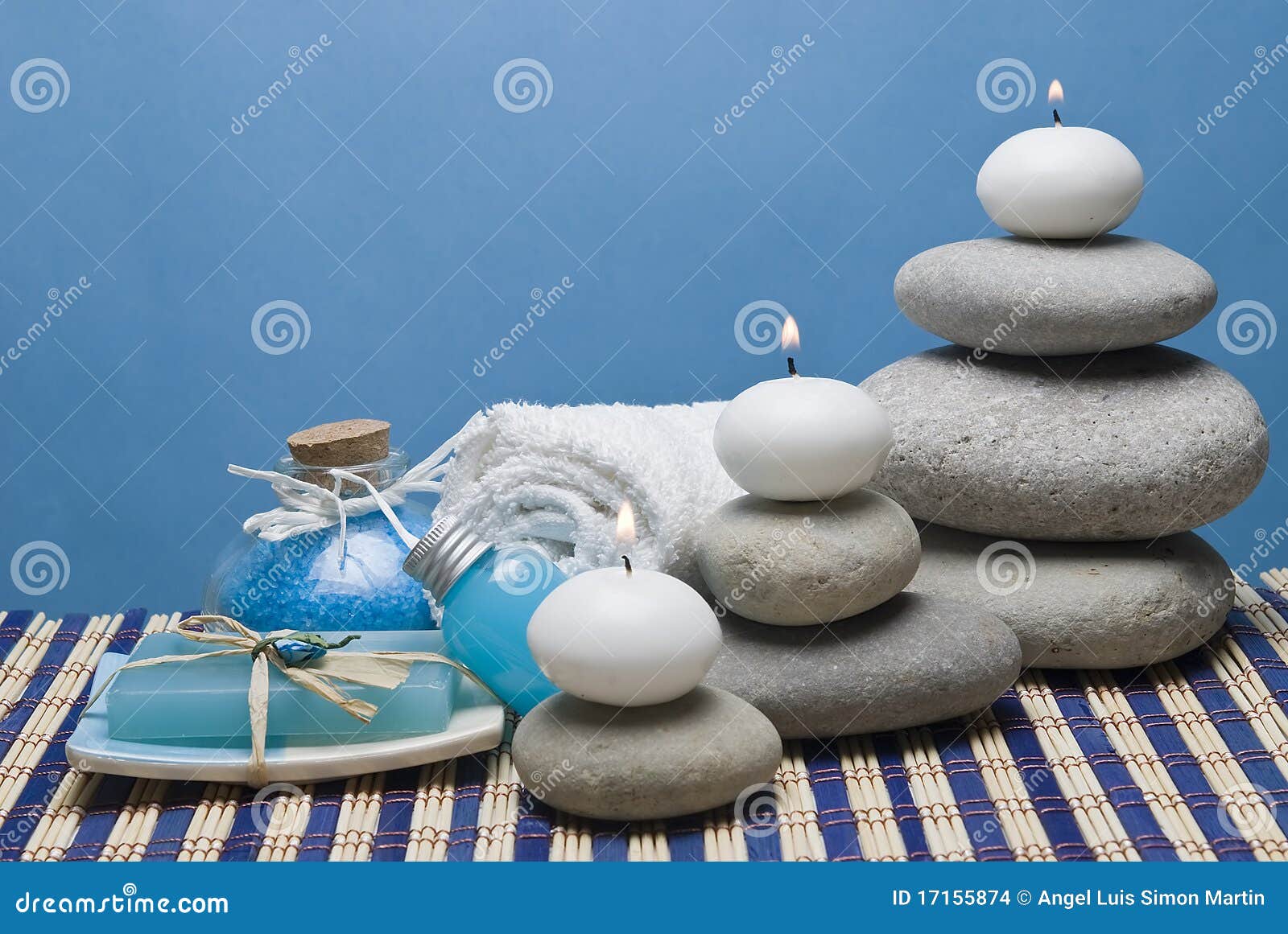 Candles in the spa. Spa background with some blue hygiene items and some candles.