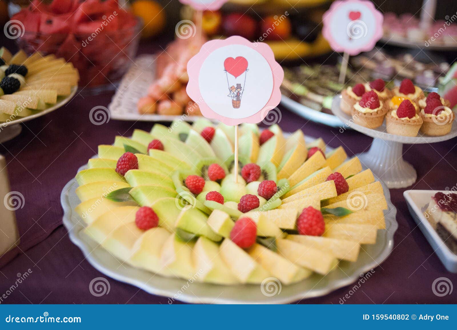 Candy Bar.Different Delicious Fruits on Wedding Reception Table with