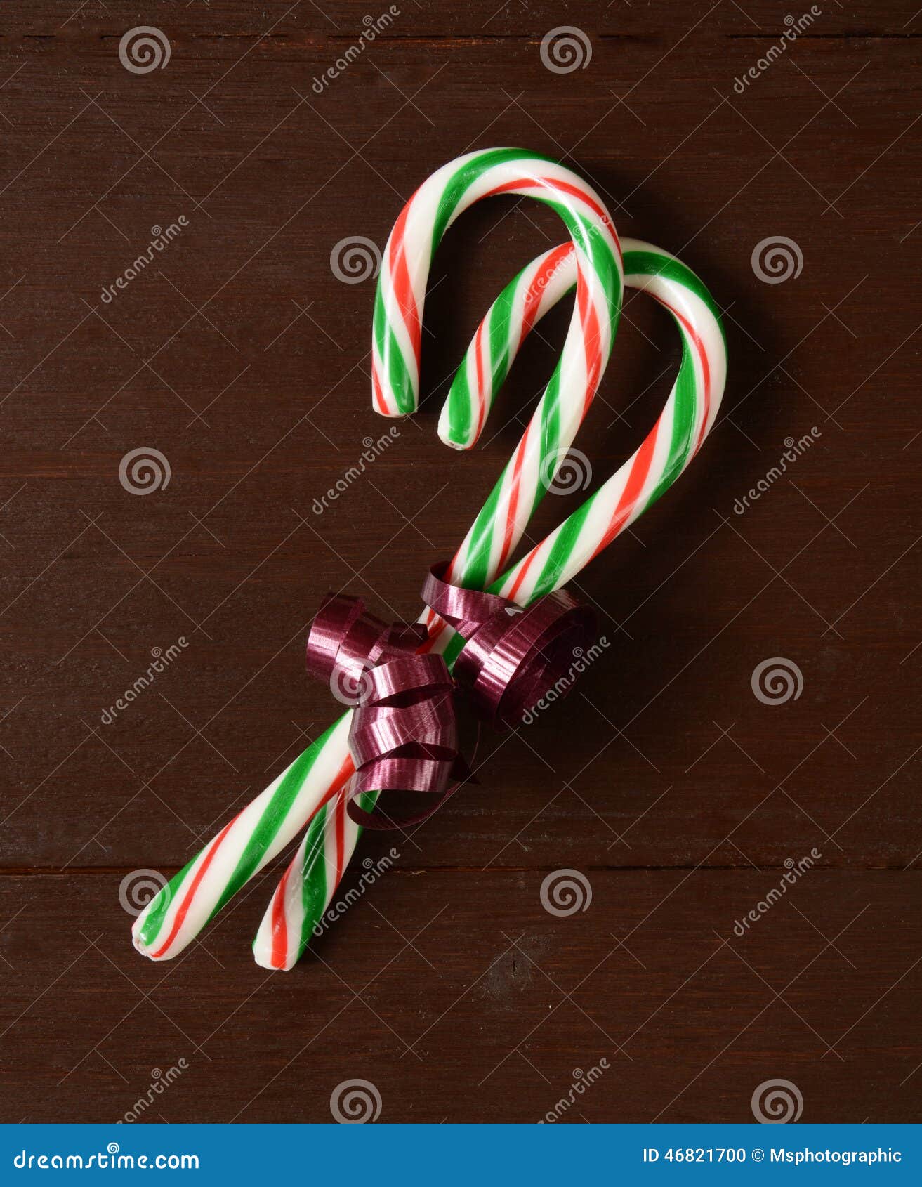 Candy canes in a bow stock photo. Image of celebration - 46821700