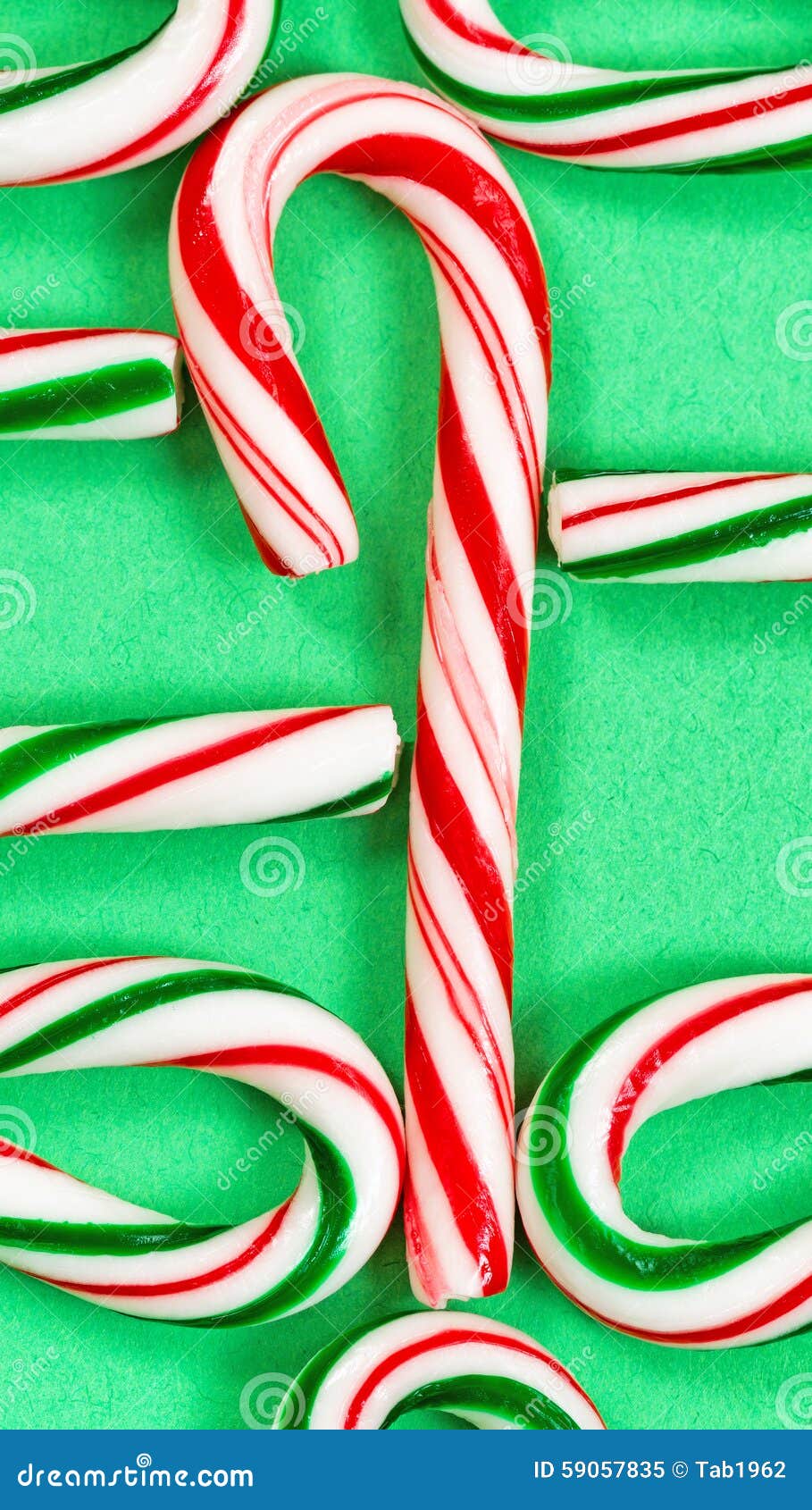 Candy Canes Joined in a Collection on a Green Background Stock Image