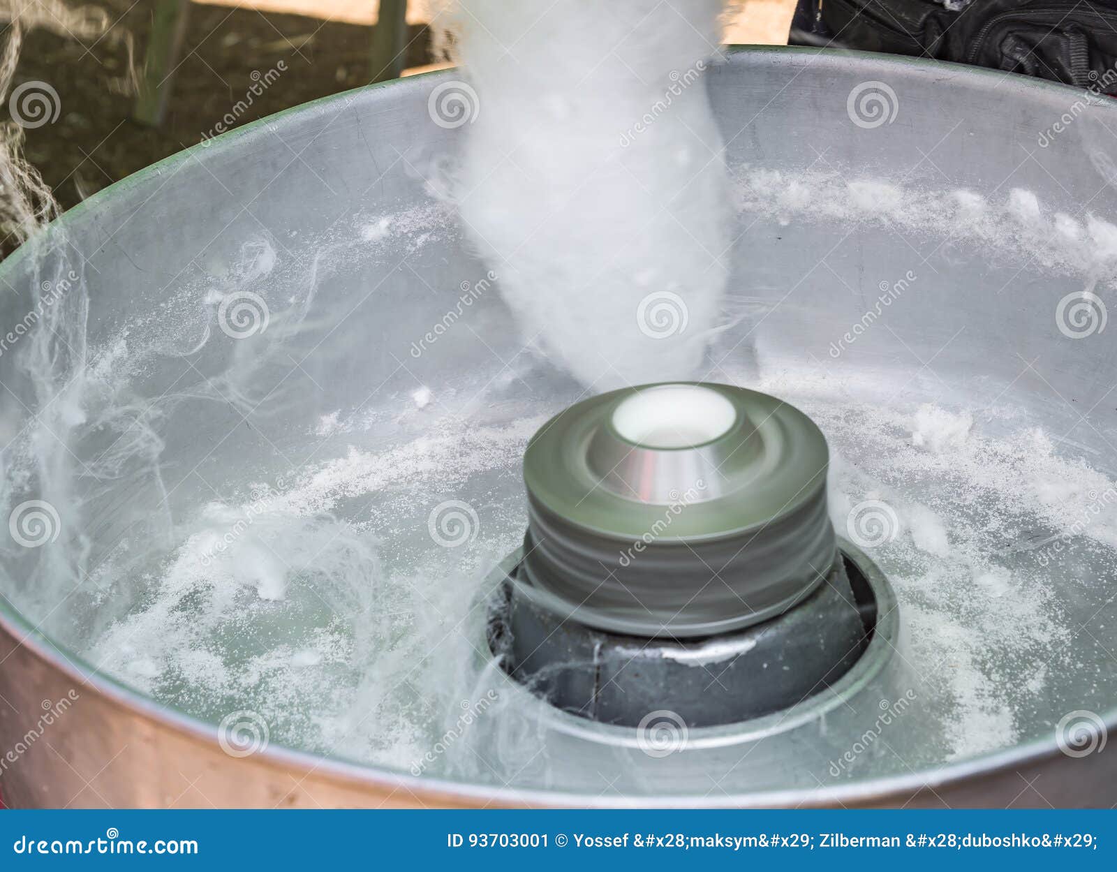Premium Photo | Hand rolling cotton candy in candy floss machine making ...