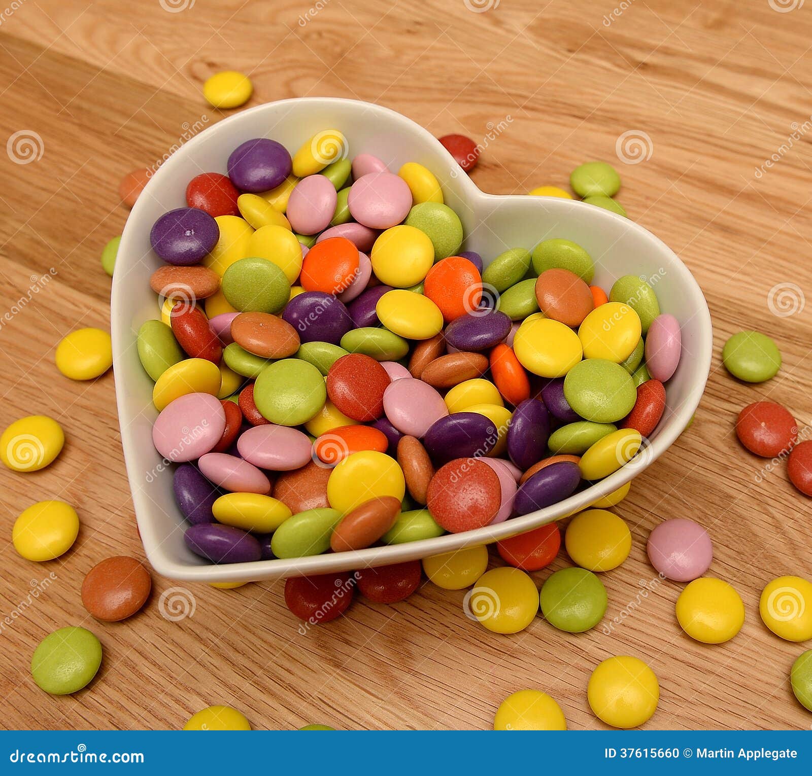 Candy in heart shaped bowl stock photo. Image of tasty 37615660