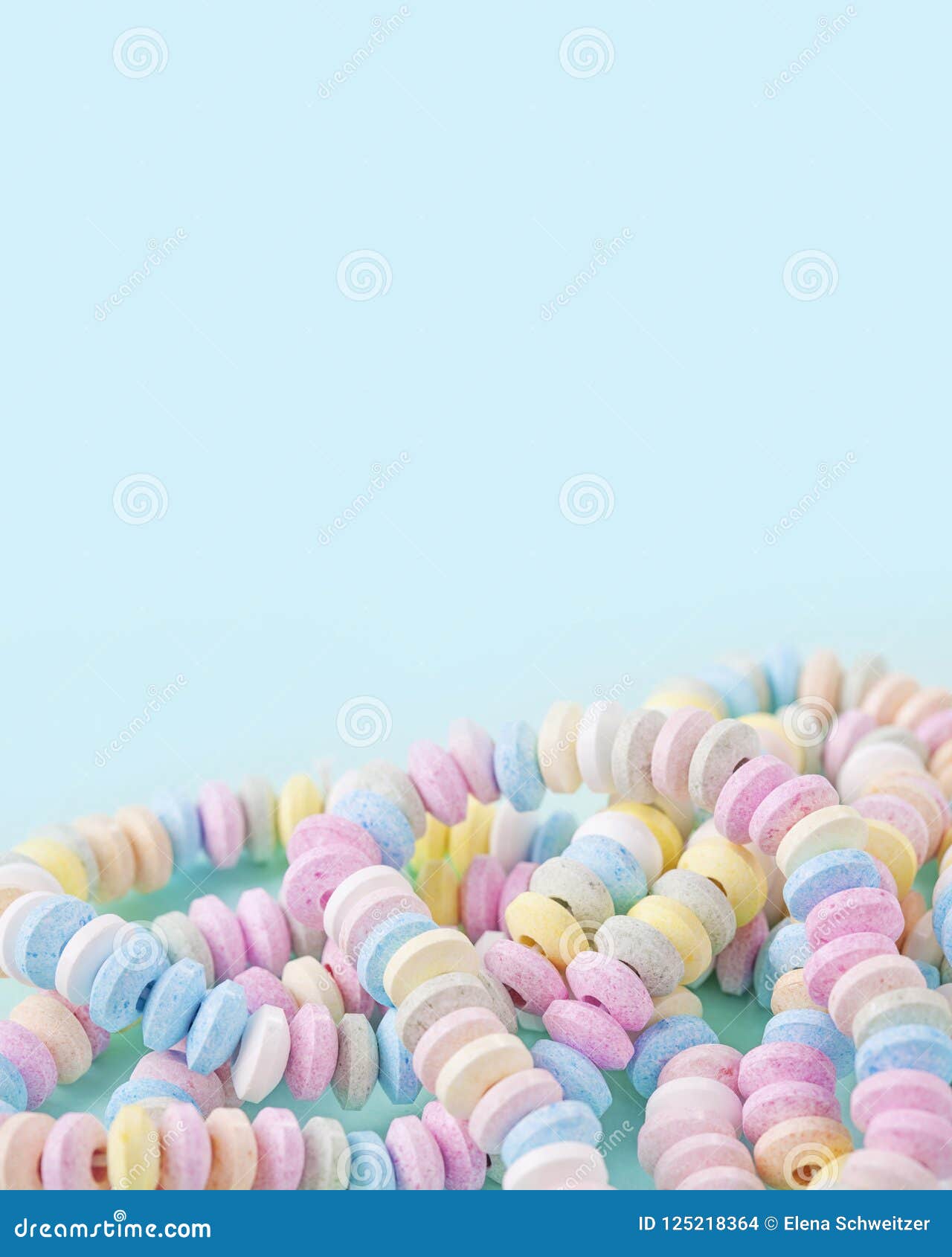 Candy Necklace Blue Pastel Colored Background Stock Photo by