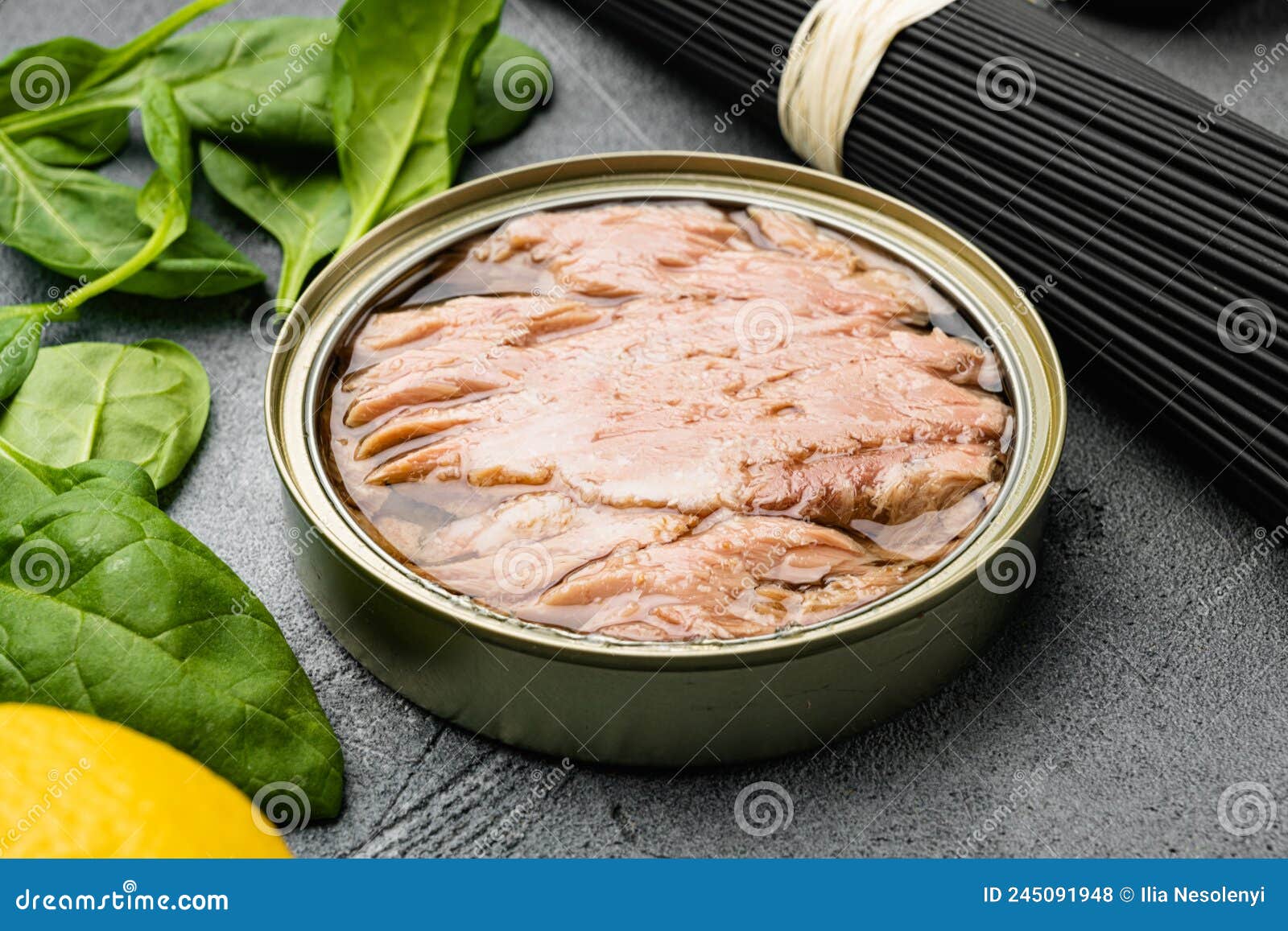 Canned Albacore Wild Tuna, on Gray Stone Table Background Stock Photo