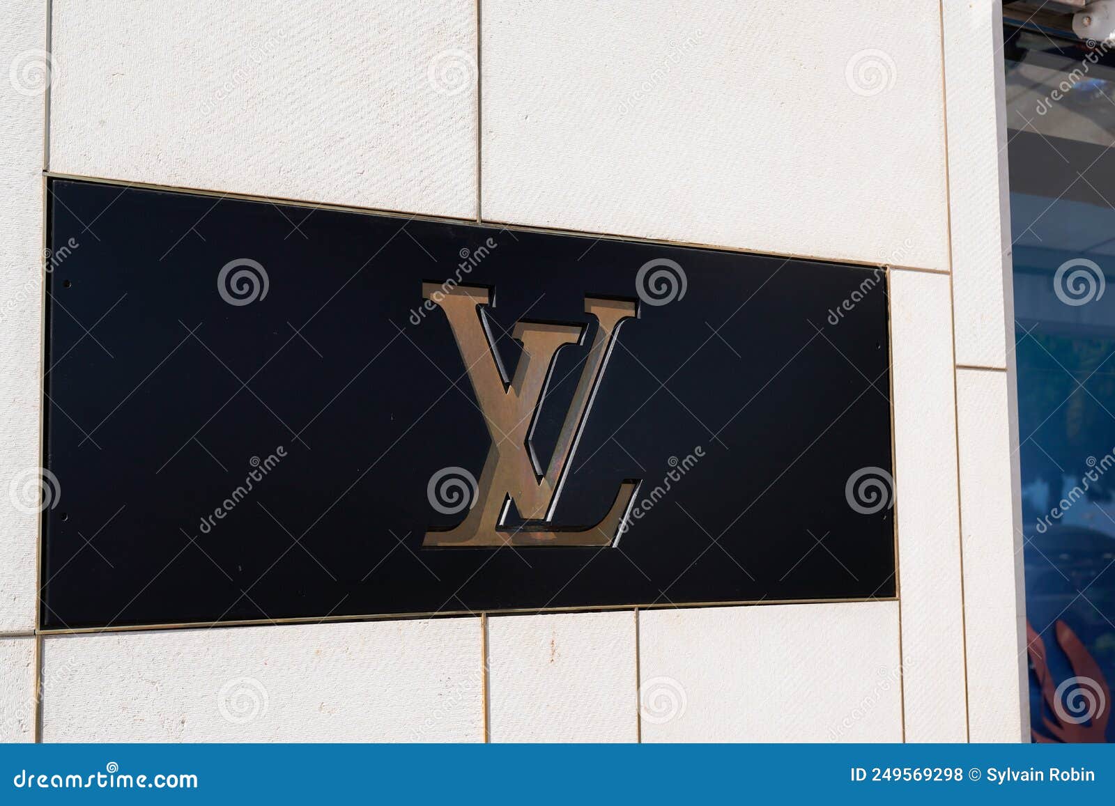 Louis Vuitton Logo and Sign Text Facade Entrance Store Fashion Brand ...