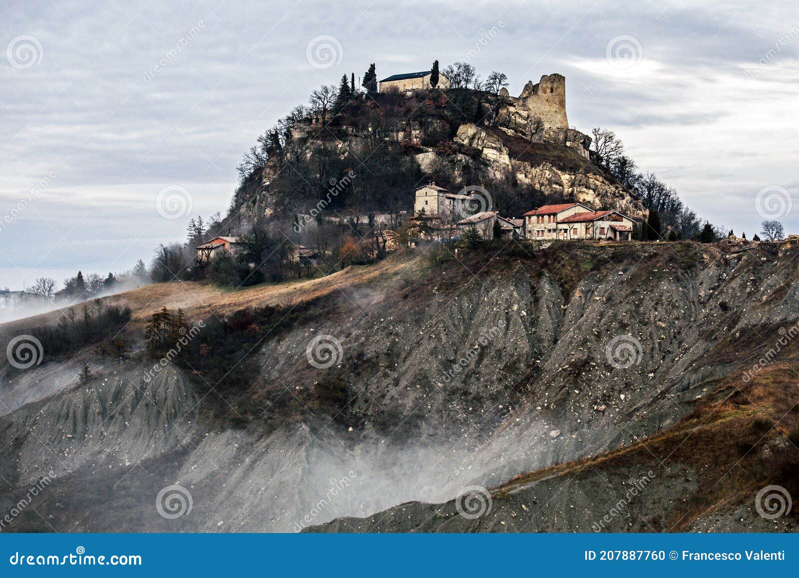 canossa castle and countryside badlands in fog, reggio emilia, italy