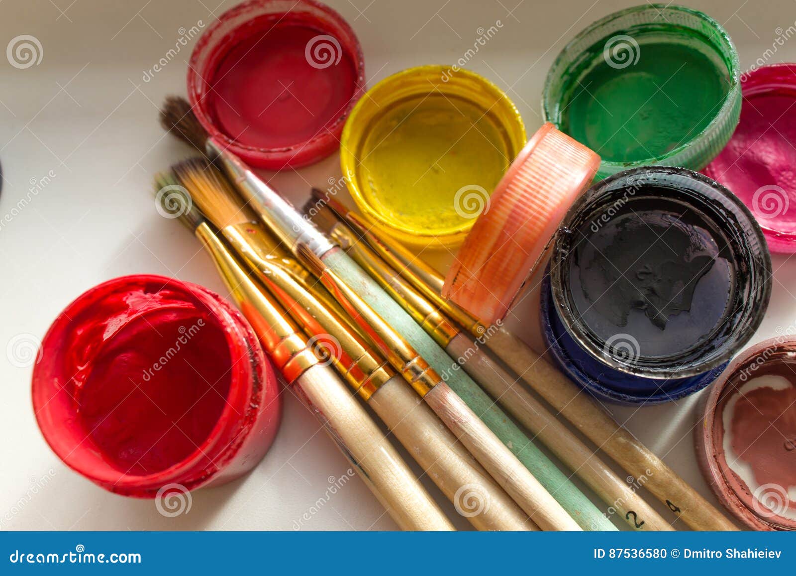 Cans of paint and a brush stock photo. Image of house - 87536580