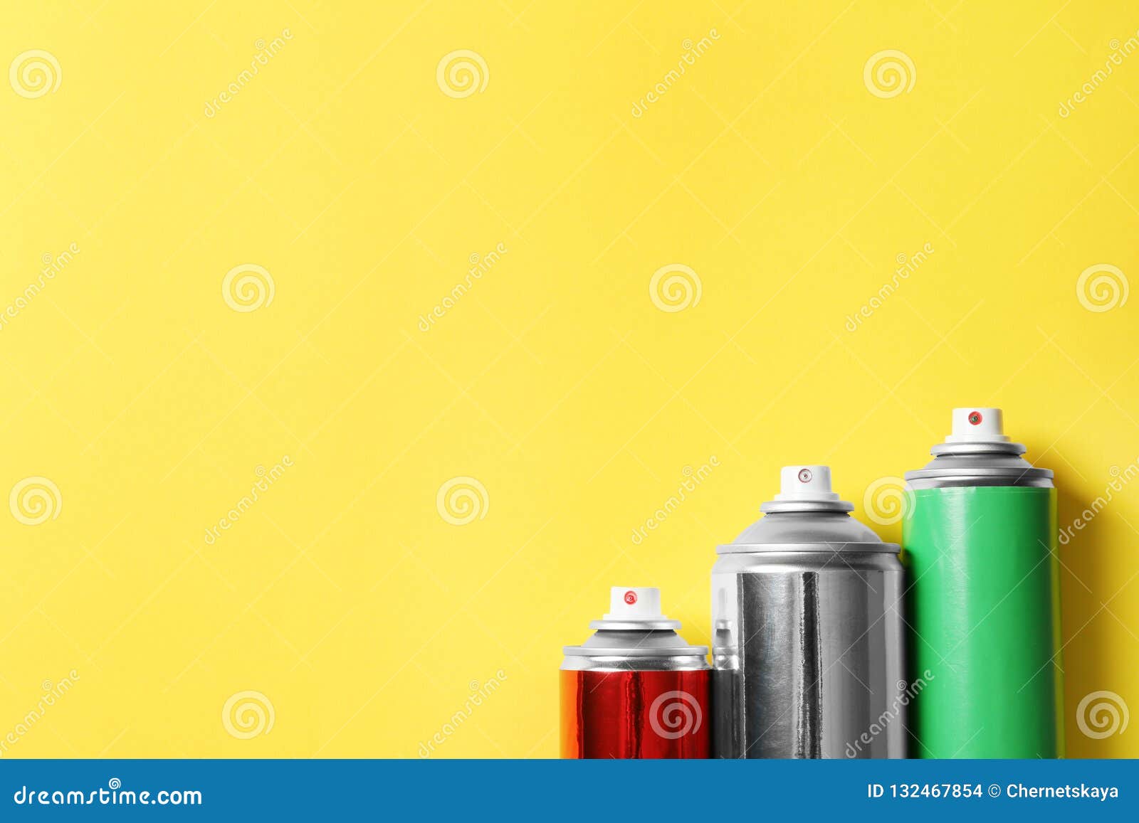 Cans of Spray Paint on Color Background, Flat Lay Stock Photo Image