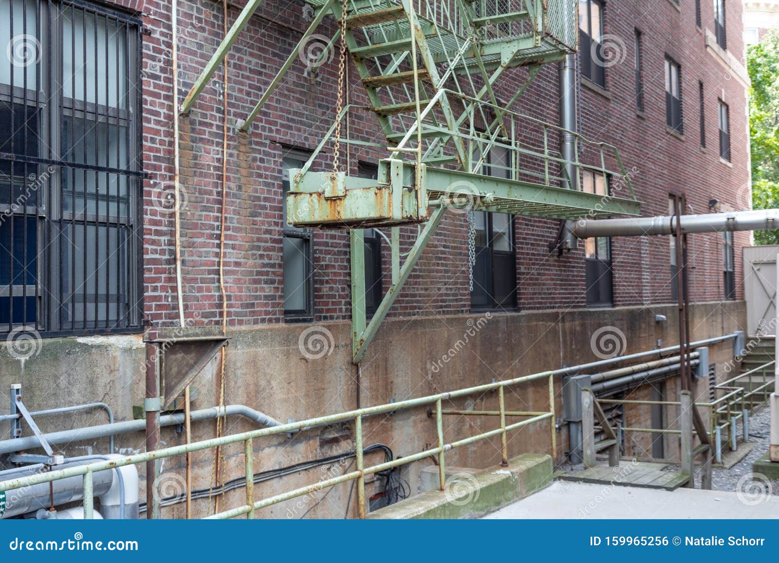 cantilevered bottom section of urban housing fire escape