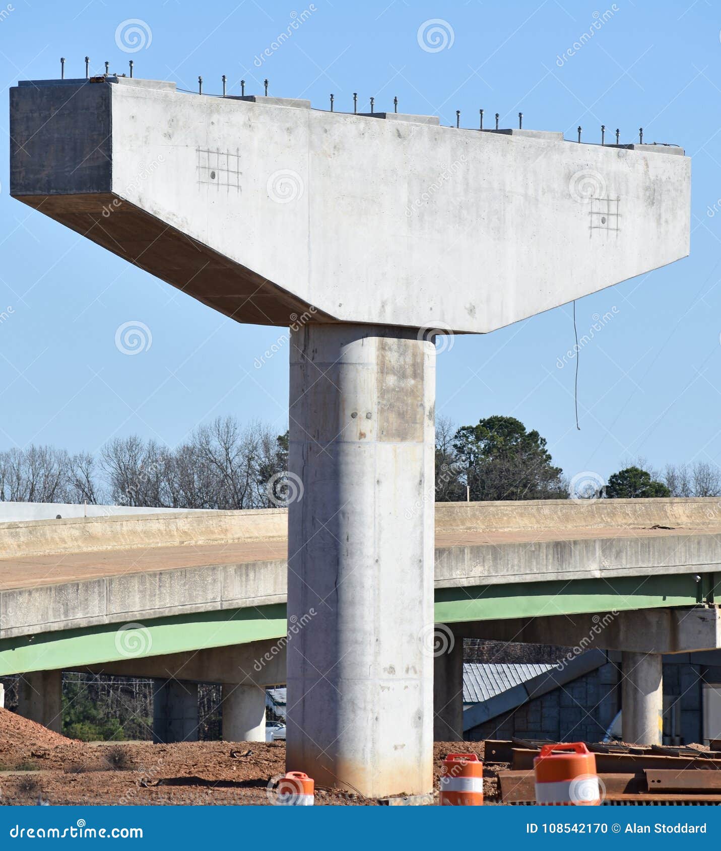 cantilevered bridge support awaits steel in highway project