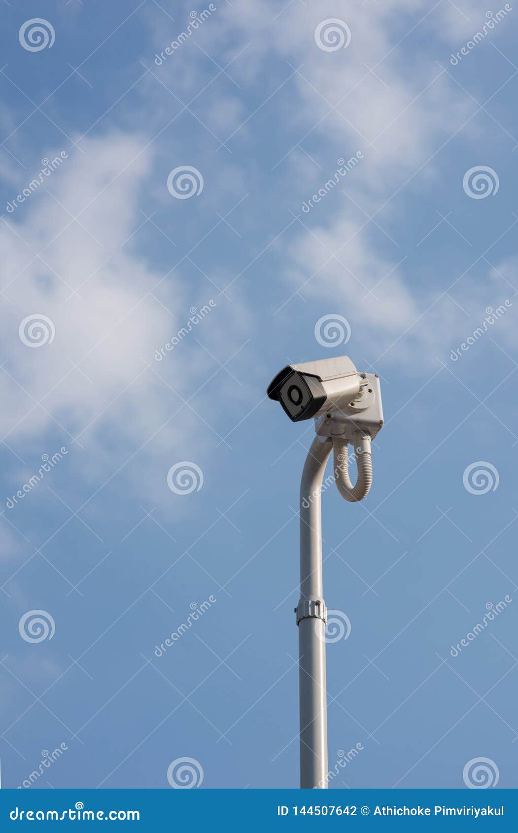a cantilevered modern white security cctv camera.