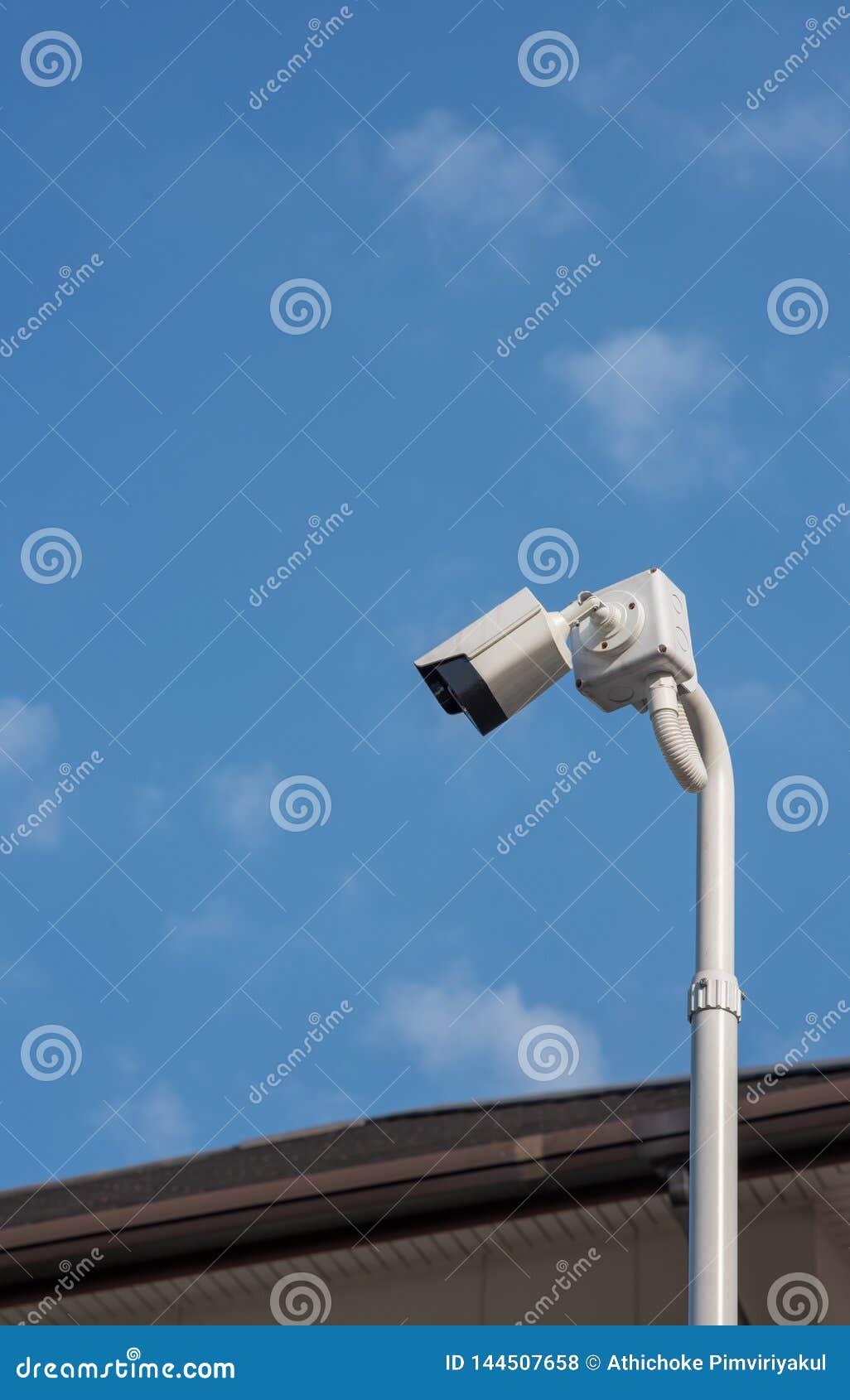 a cantilevered modern white security cctv camera.