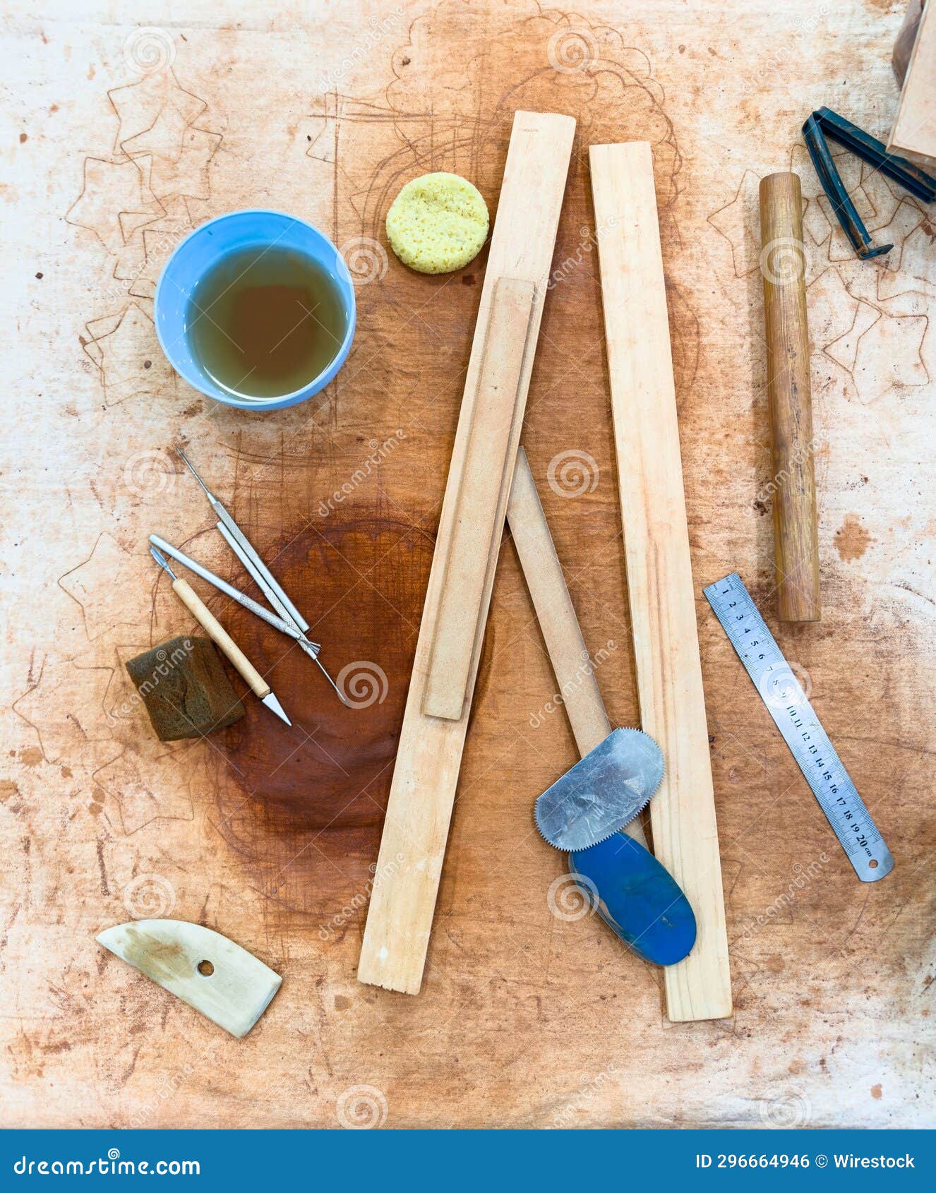 A Canvas Covered Table with Pottery Tools for Making Ceramics Stock