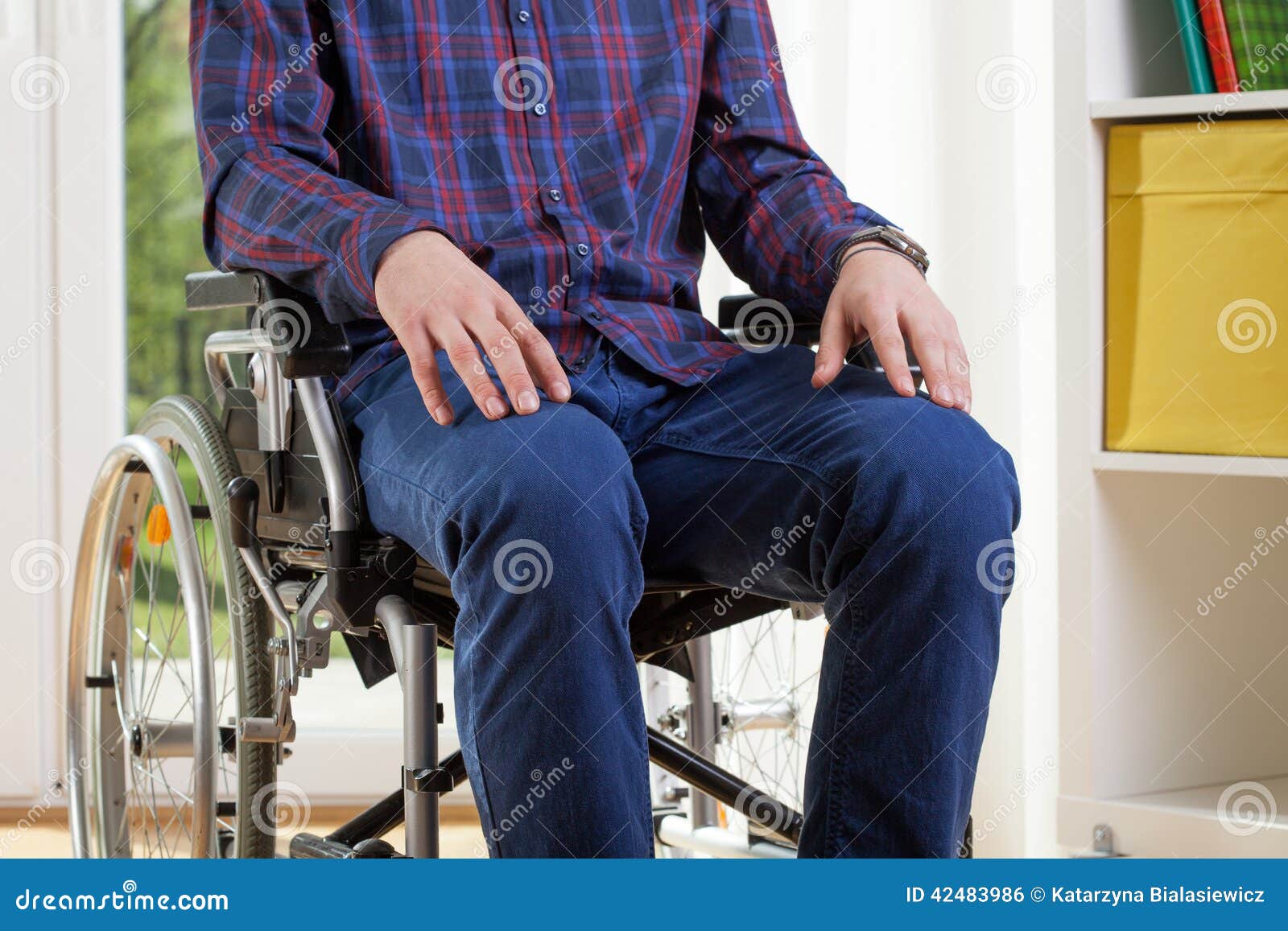 capable man in shirt on wheelchair