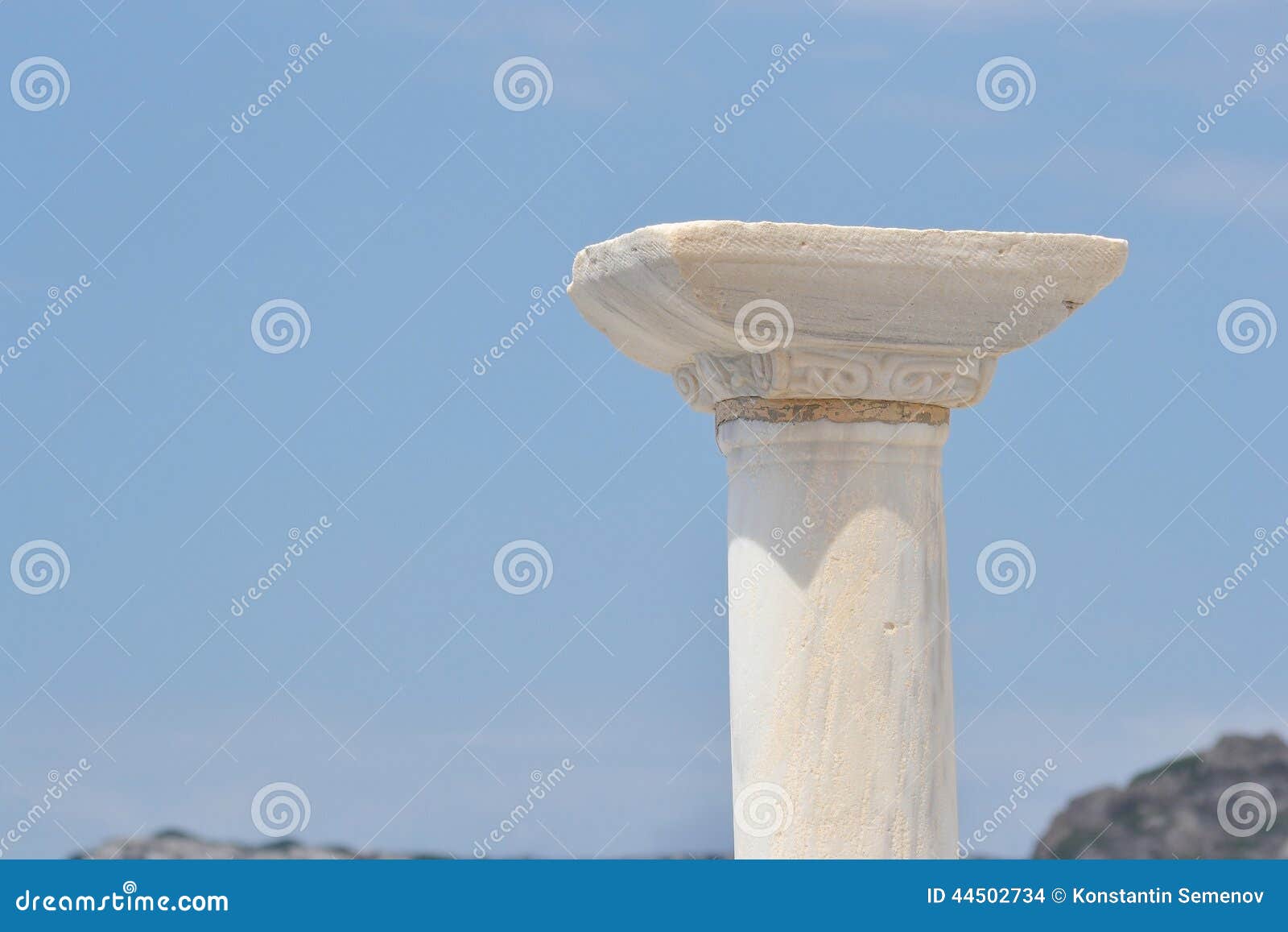 capitel of column on blue sky background.