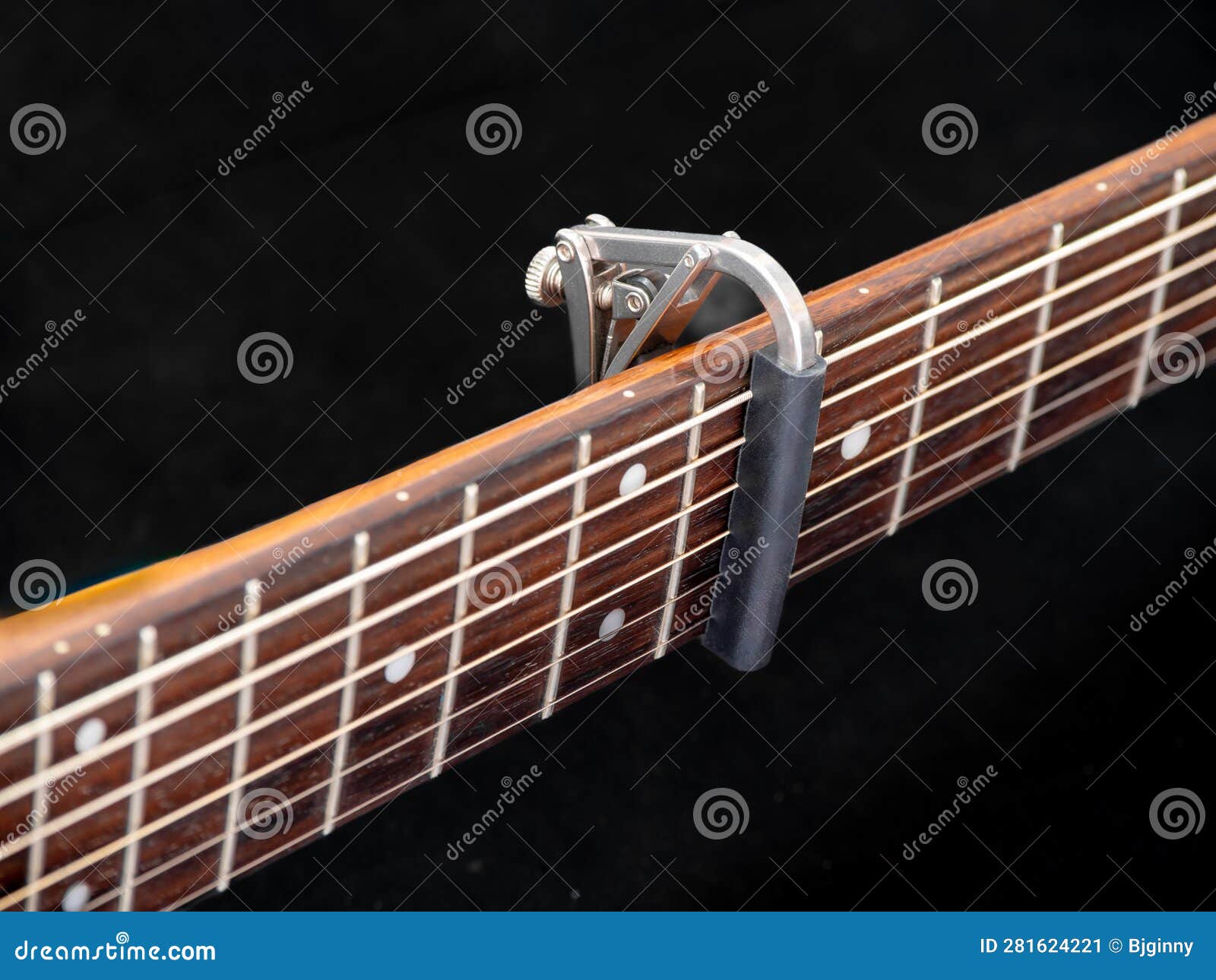 Capo on the Acoustic Guitar Neck , Capro Made from Aluminium, Selective