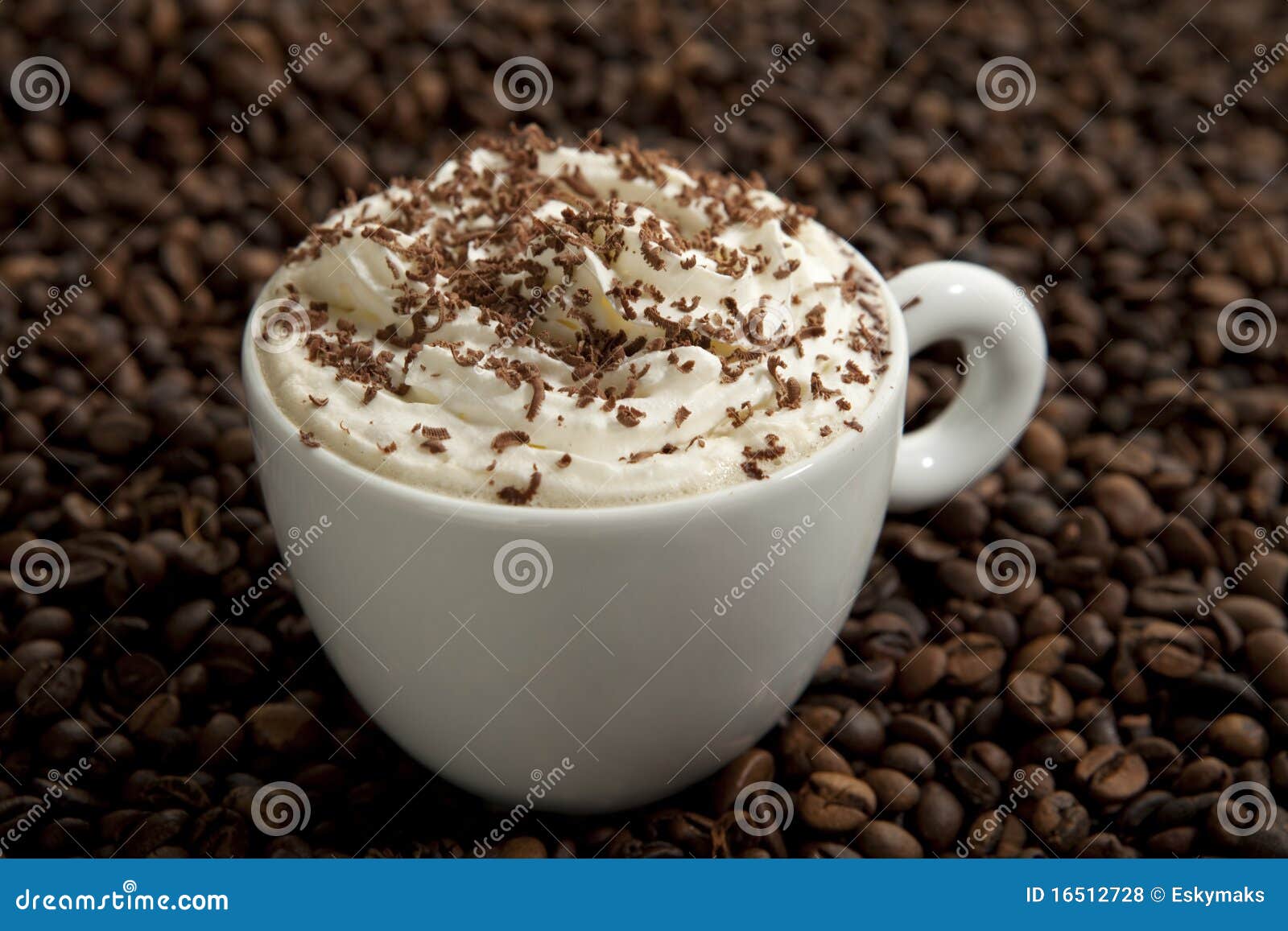 Cappuccino in coffee beans stock photo. Image of energy 16512728